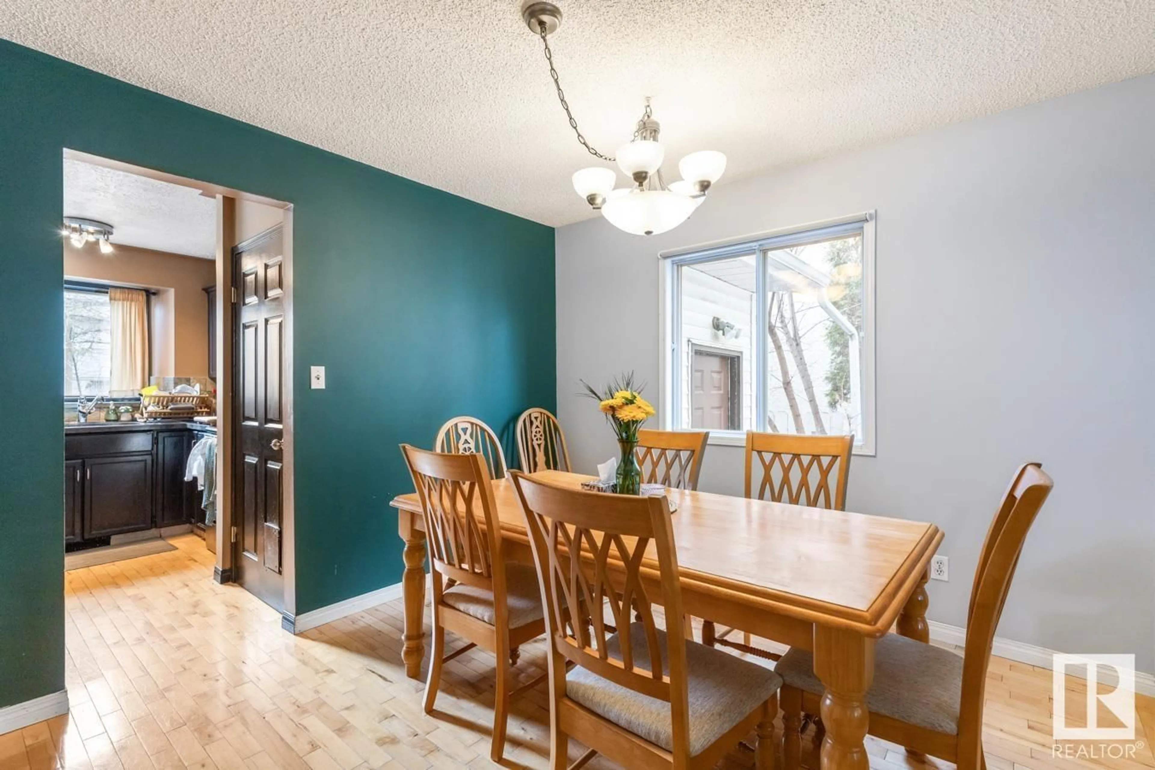 Dining room, wood/laminate floor for NW - 3450 37 ST, Edmonton Alberta T6L4Y9