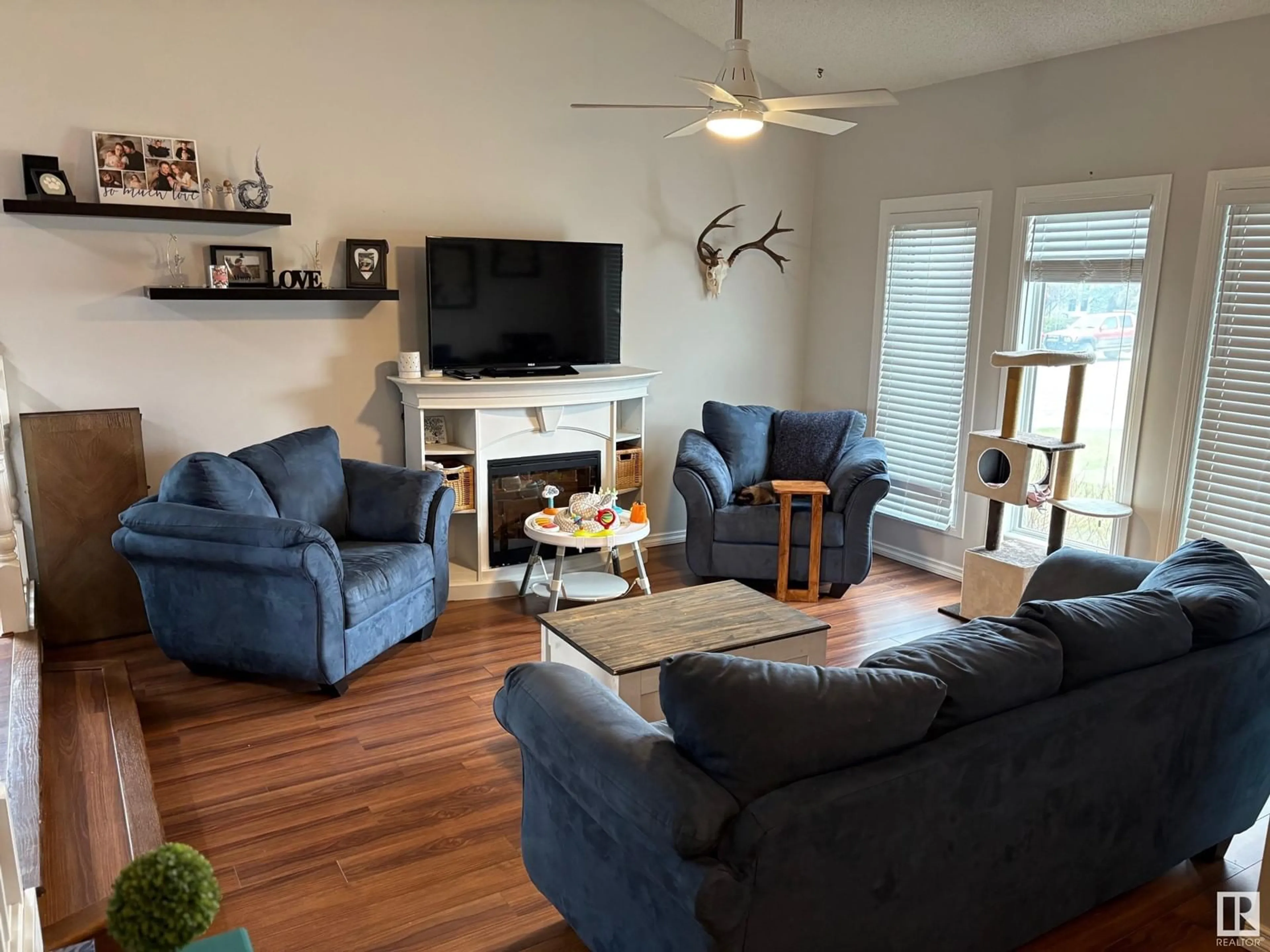 Living room with furniture, wood/laminate floor for 4511 53 AVE, Tofield Alberta T0B4J0