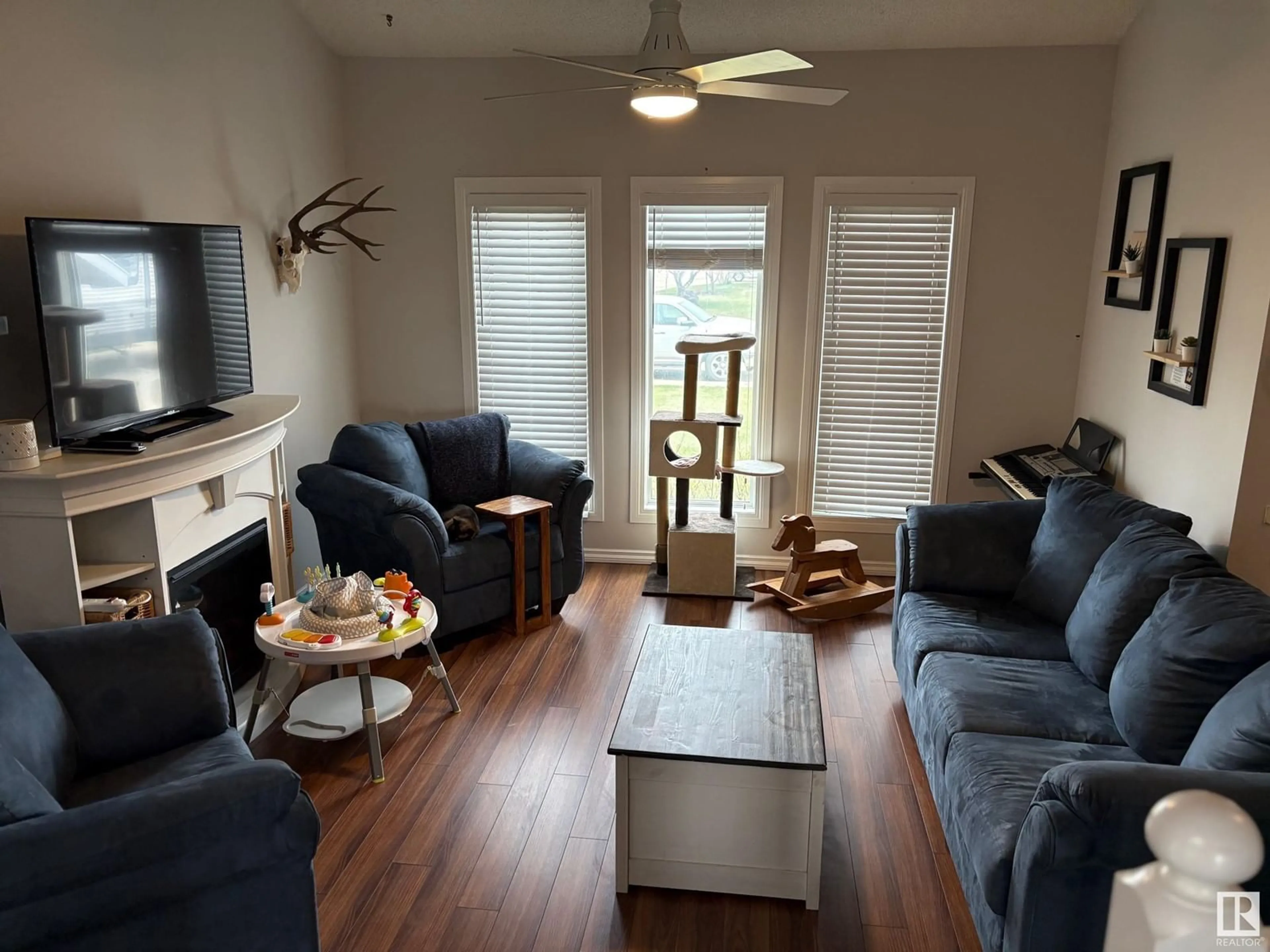 Living room with furniture, wood/laminate floor for 4511 53 AVE, Tofield Alberta T0B4J0