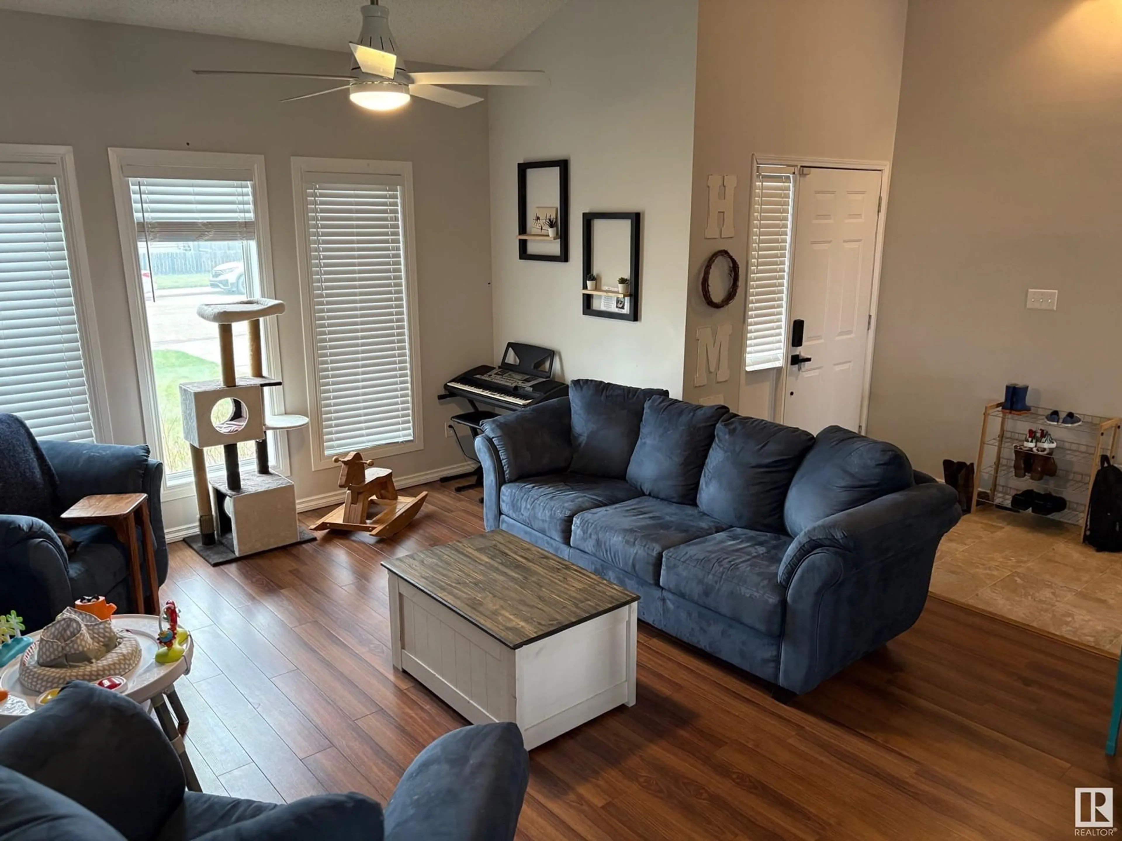 Living room with furniture, wood/laminate floor for 4511 53 AVE, Tofield Alberta T0B4J0