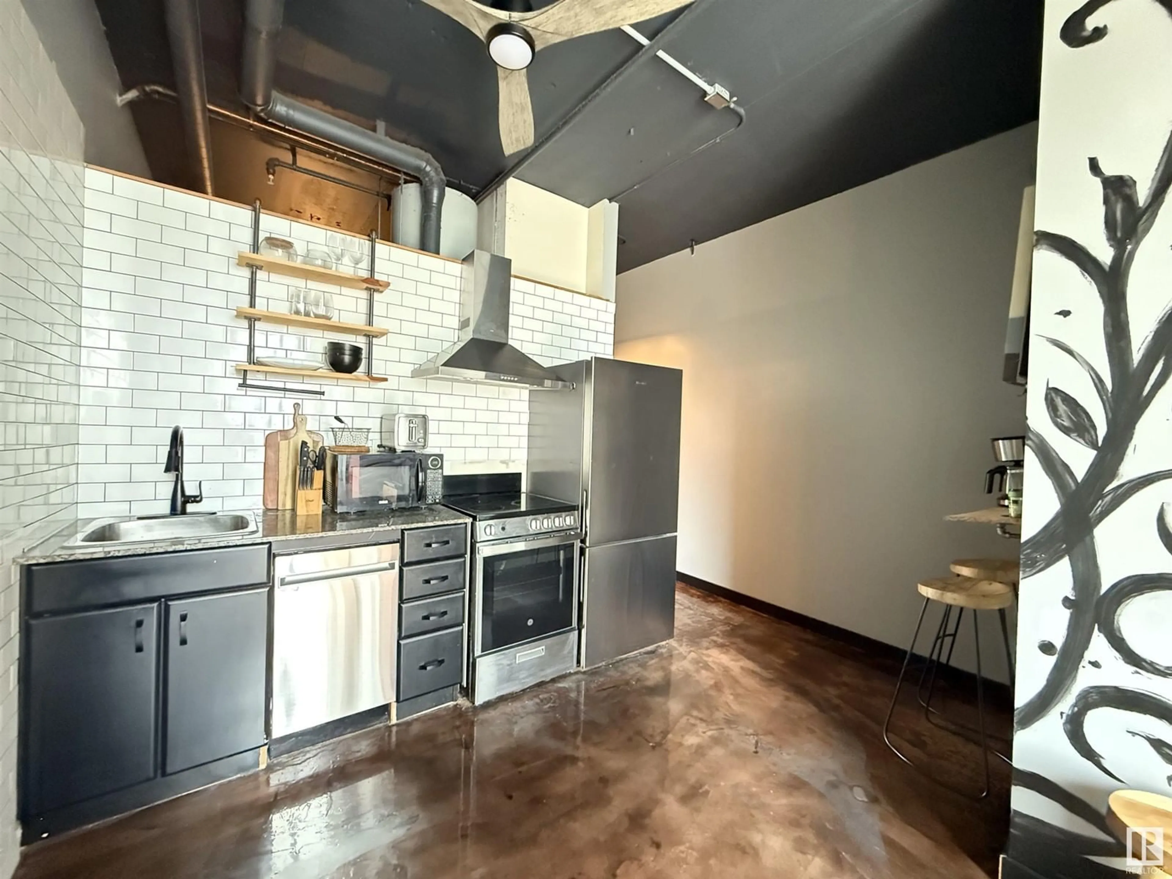 Open concept kitchen, cement floor for 10024 - 612 JASPER AV, Edmonton Alberta T5J1R9