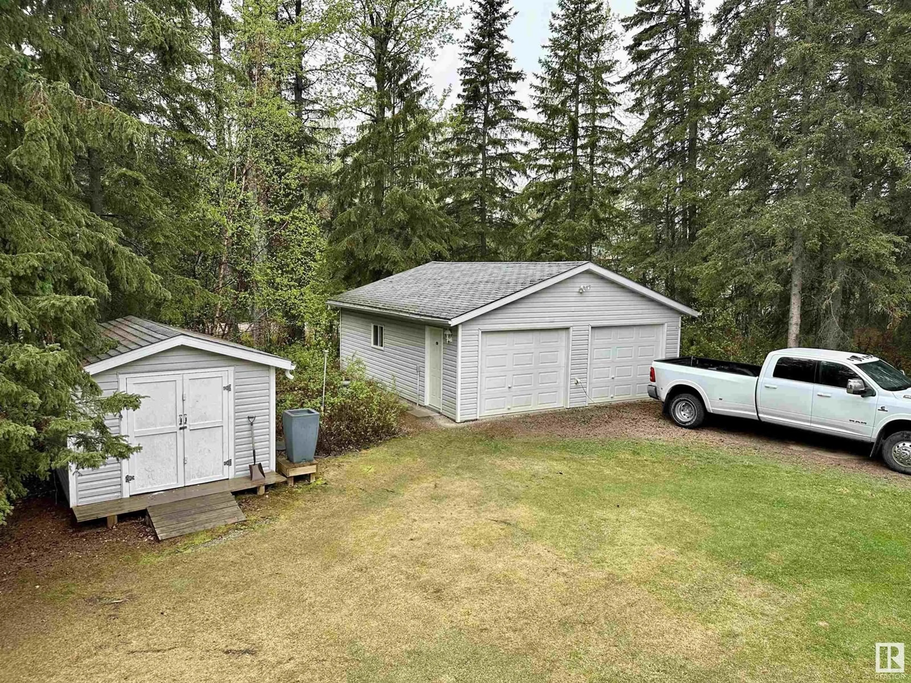 A pic from outside/outdoor area/front of a property/back of a property/a pic from drone, forest/trees view for 4713 50 AVE, Violet Grove Alberta T7A2A1