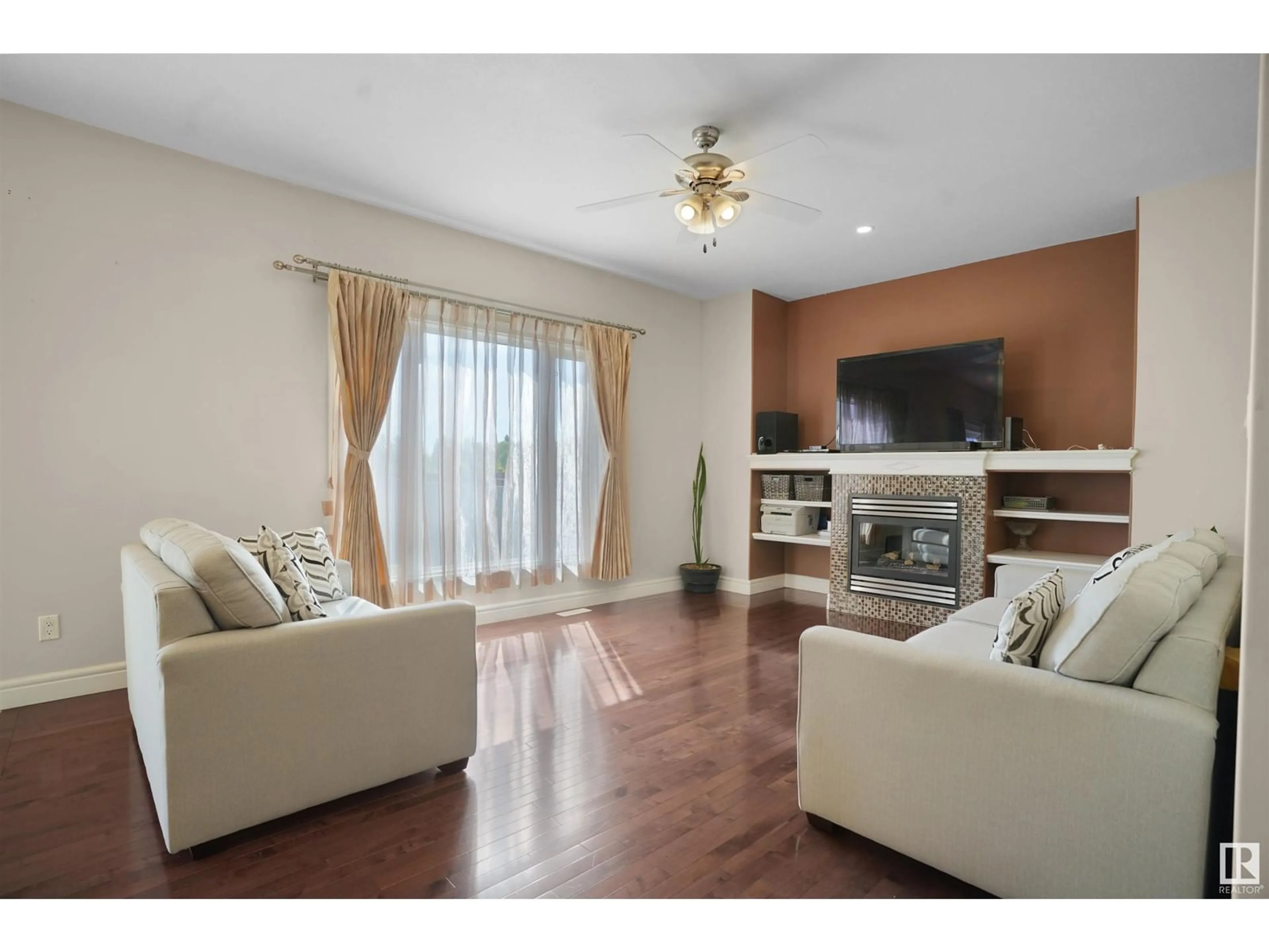 Living room with furniture, wood/laminate floor for 3351 18 ST, Edmonton Alberta T6T0H4