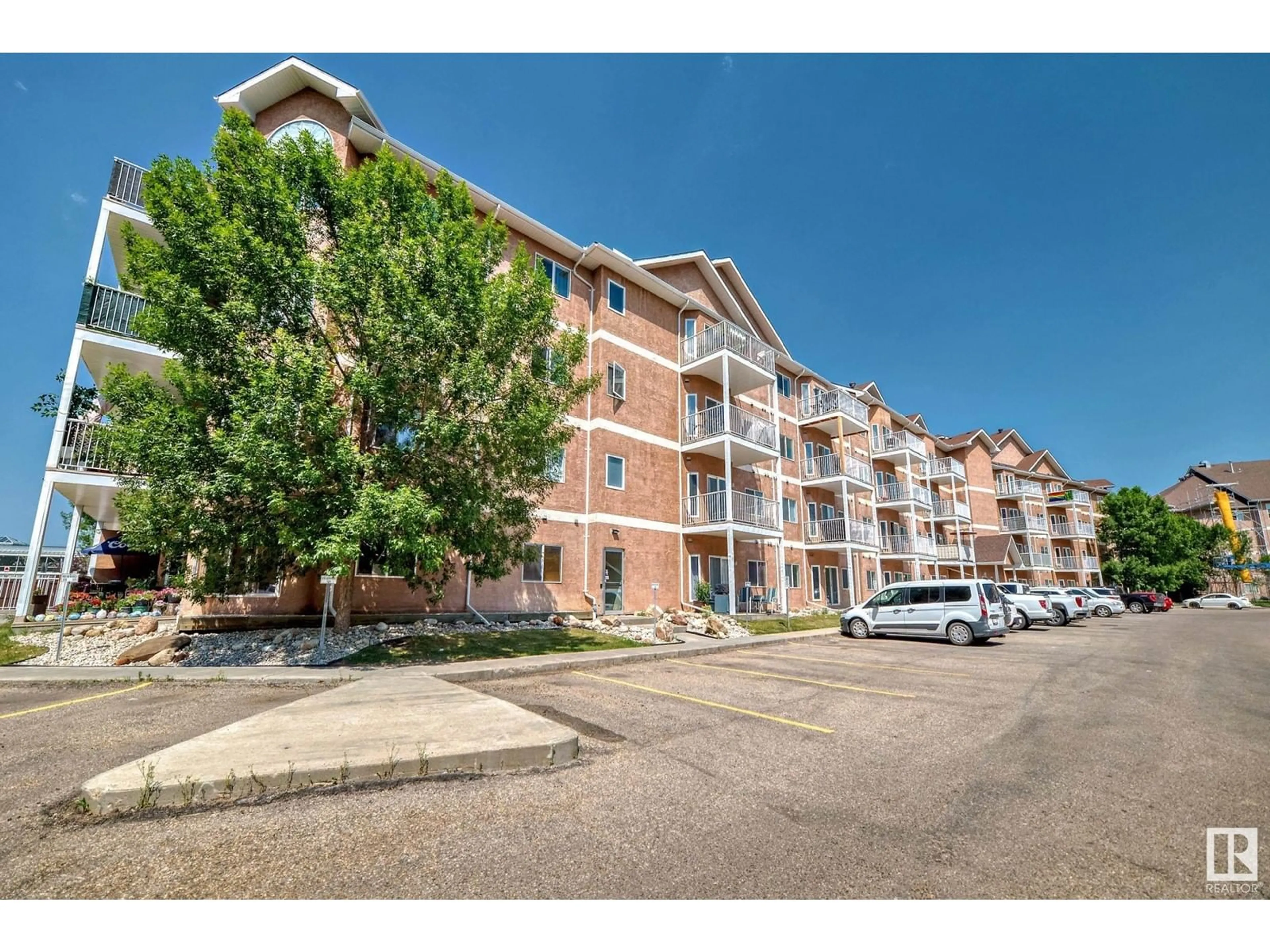 A pic from outside/outdoor area/front of a property/back of a property/a pic from drone, street for #409 - 4316 139 AV, Edmonton Alberta T5Y0L1