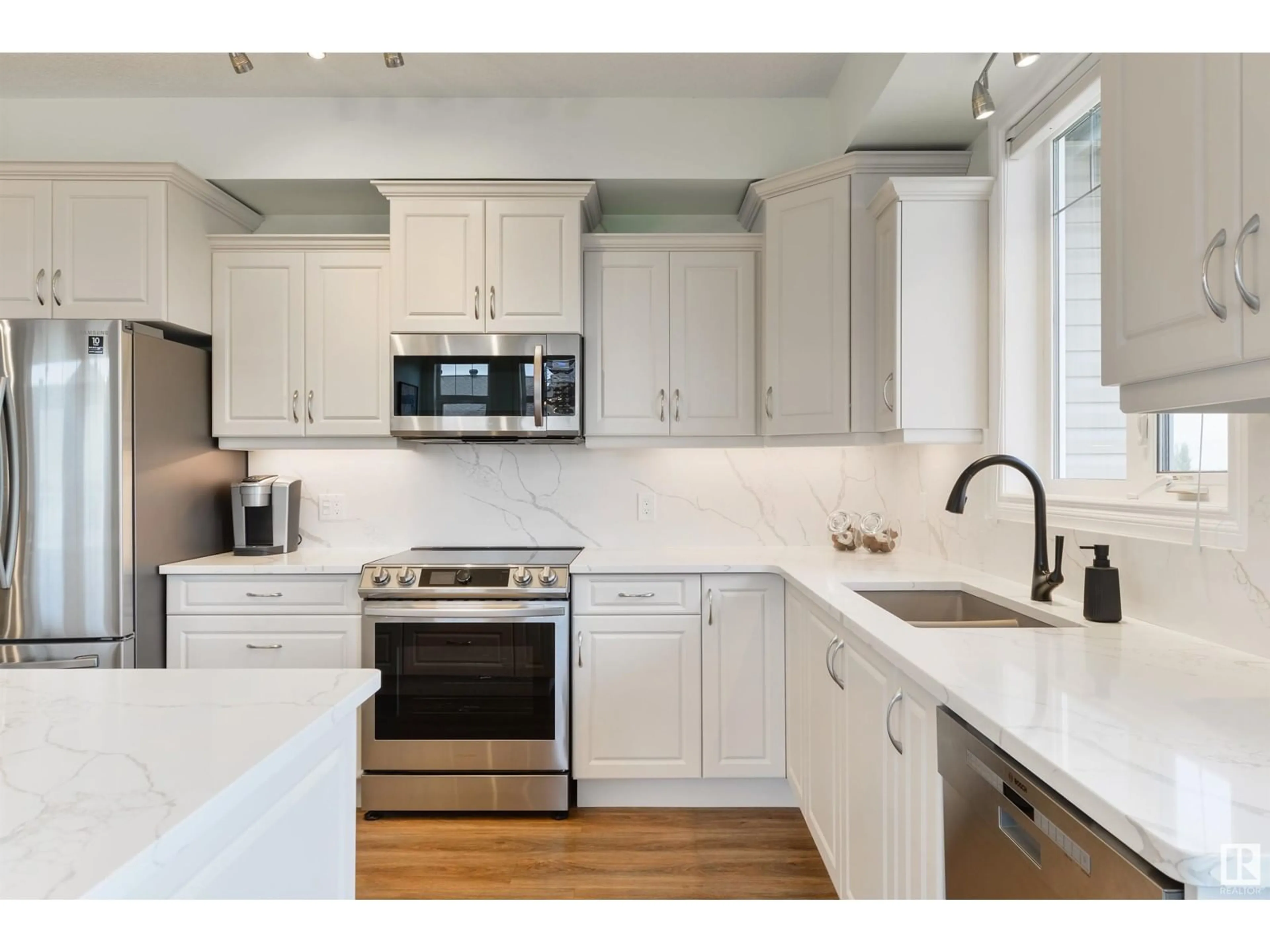 Open concept kitchen, ceramic/tile floor for #421 - 12408 15 AV, Edmonton Alberta T6W1X2