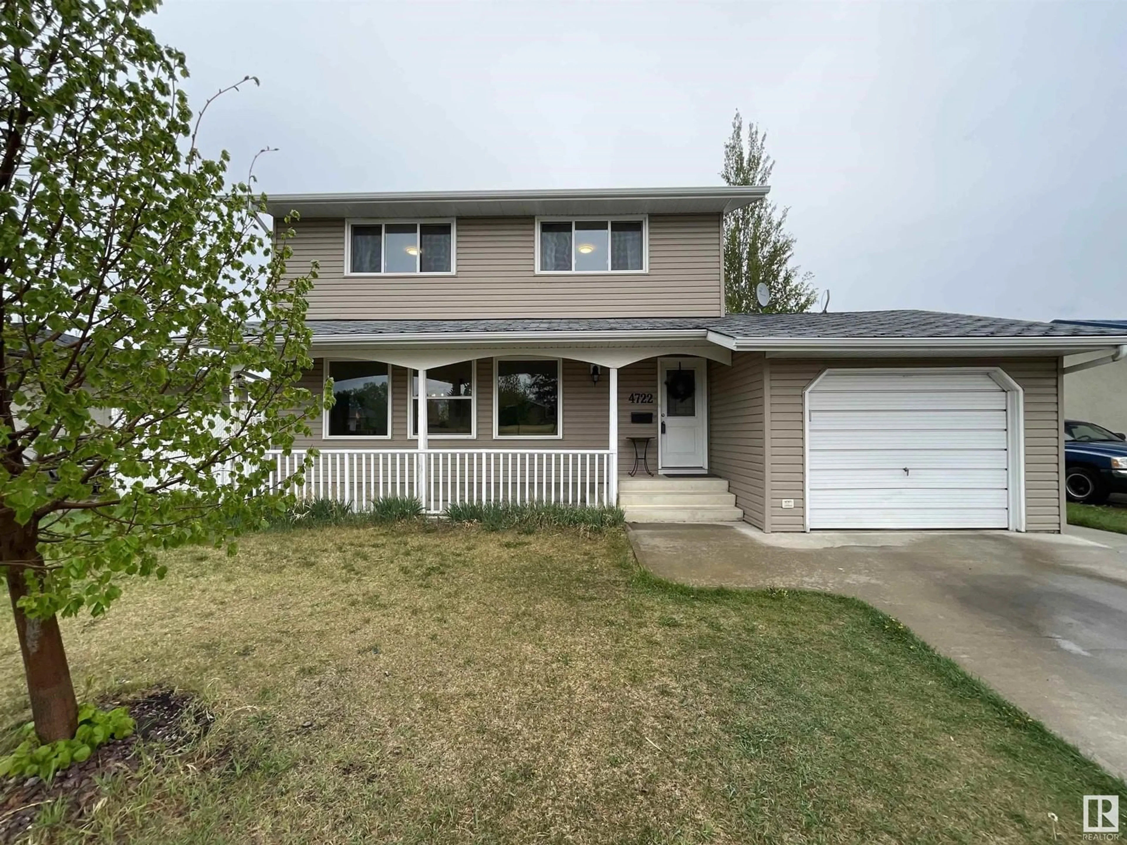 Home with vinyl exterior material, street for NW - 4722 127B AV, Edmonton Alberta T5A2M9