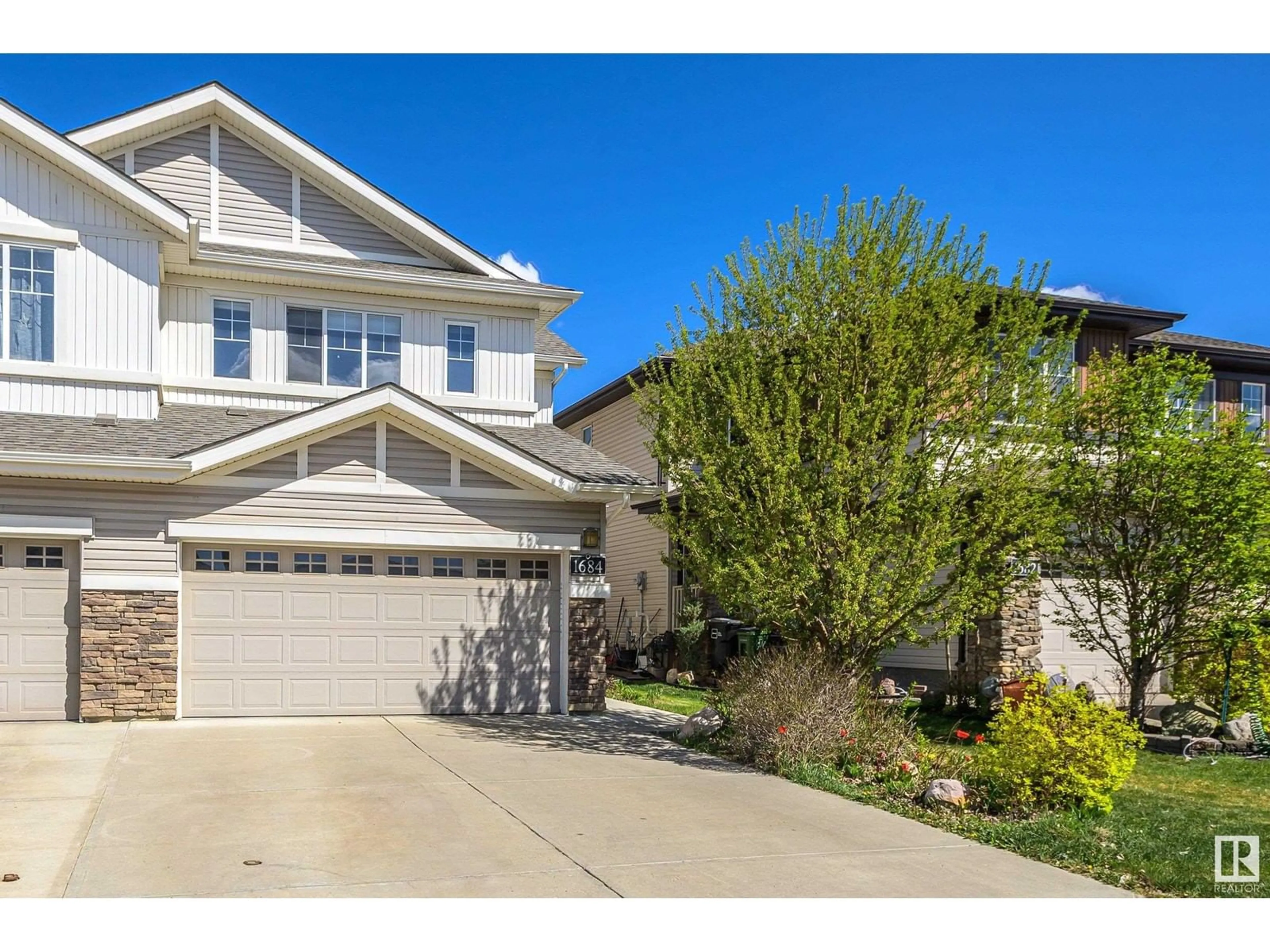 Home with vinyl exterior material, street for SW - 1684 CUNNINGHAM WY, Edmonton Alberta T6W0W5