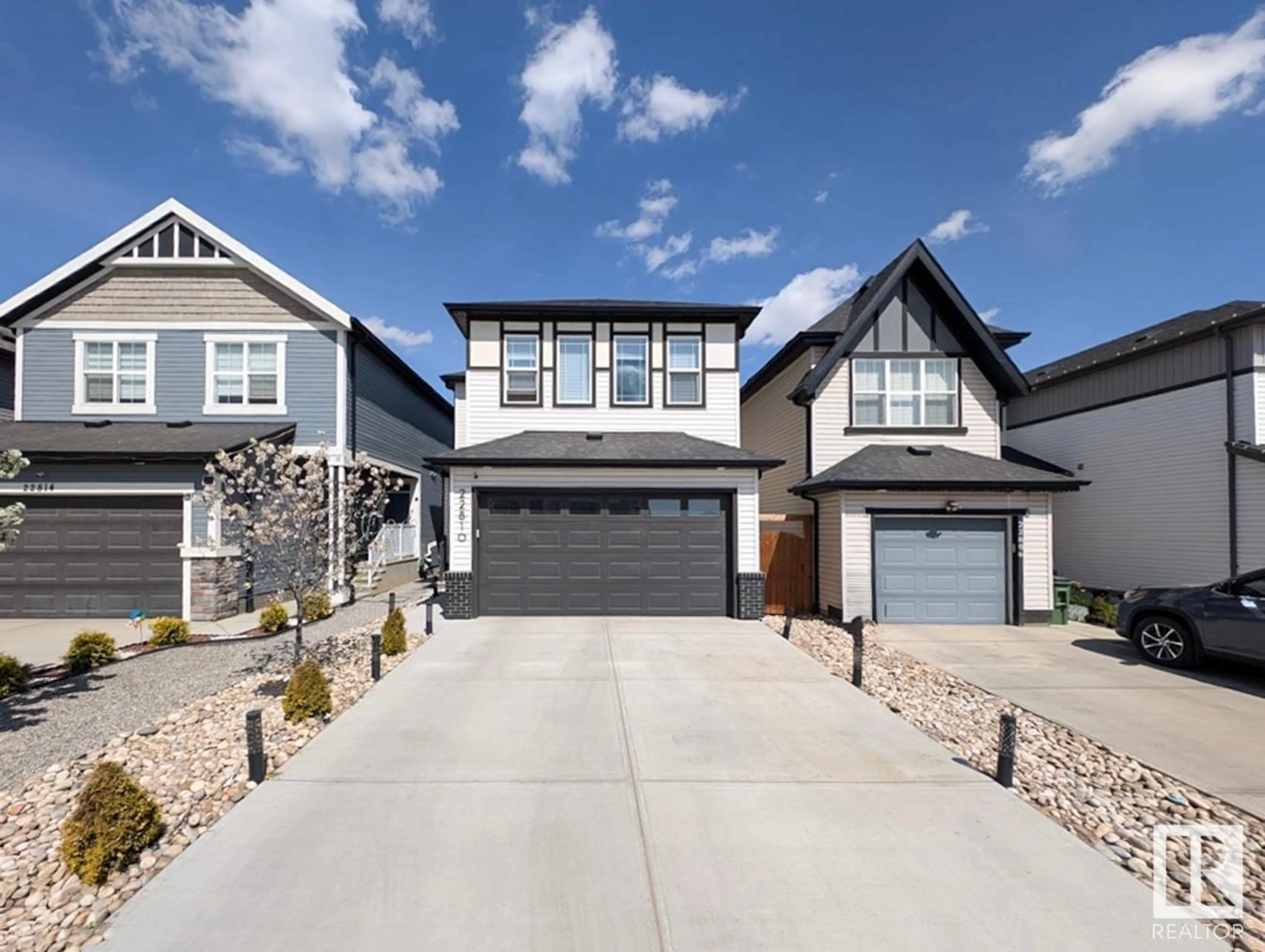Home with vinyl exterior material, street for 22810 95A AV, Edmonton Alberta T5T7H5