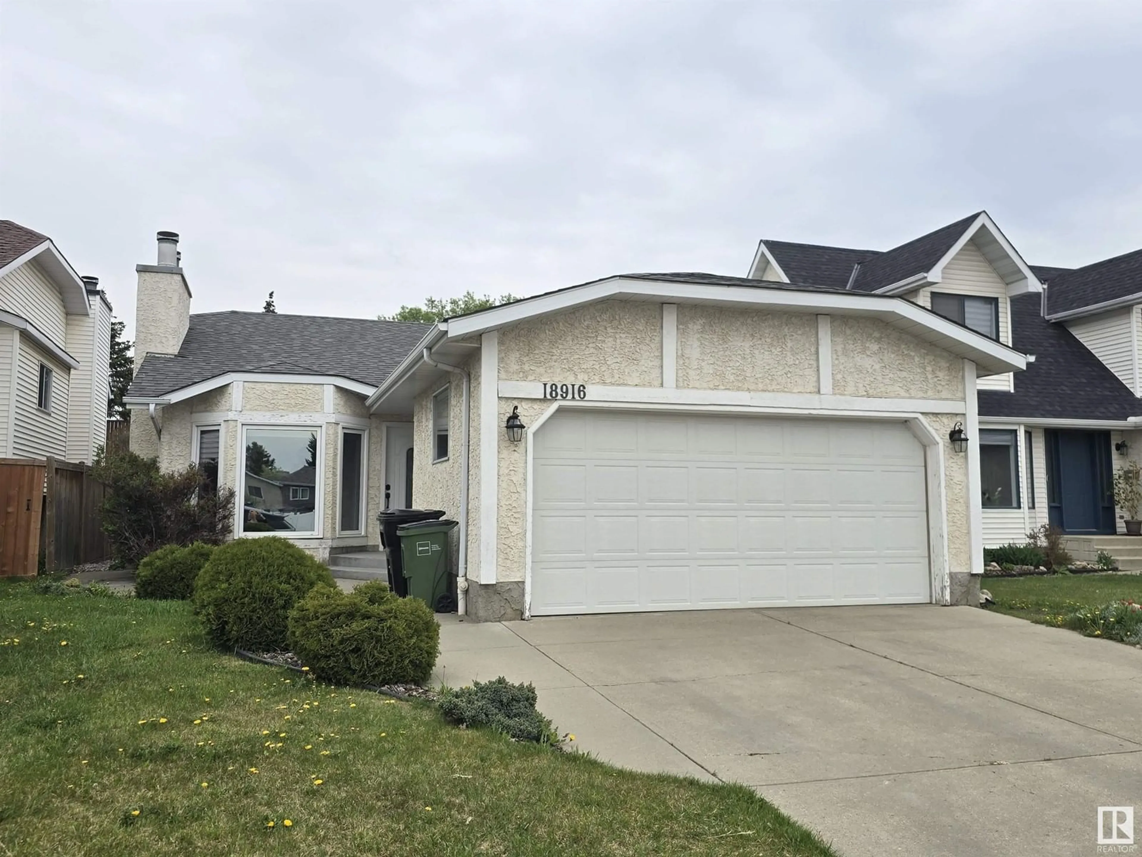Home with vinyl exterior material, street for 18916 78 AV, Edmonton Alberta T5T5J2