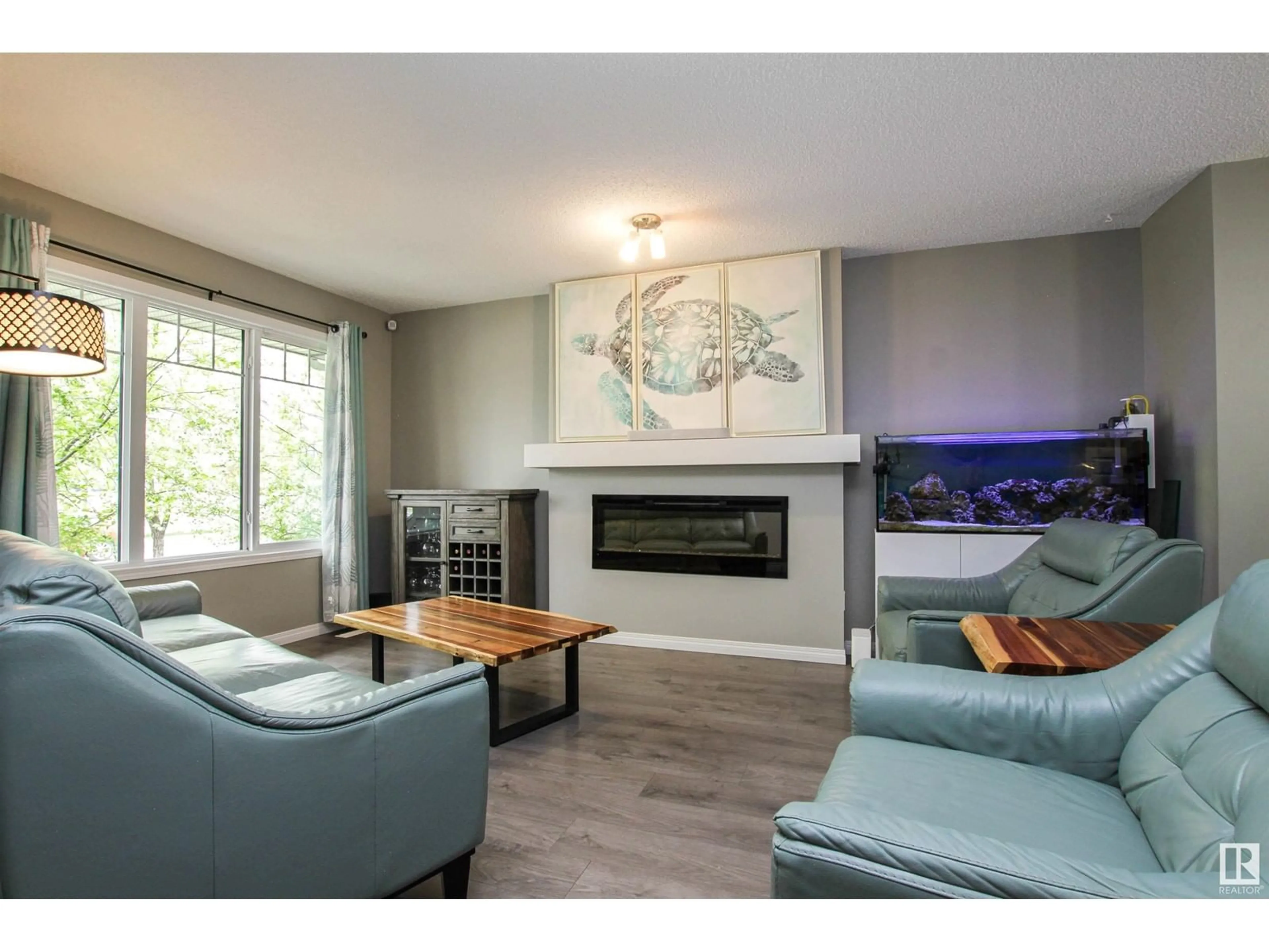 Living room with furniture, wood/laminate floor for SW - 3347 ORCHARDS LINK LI, Edmonton Alberta T6X2B4