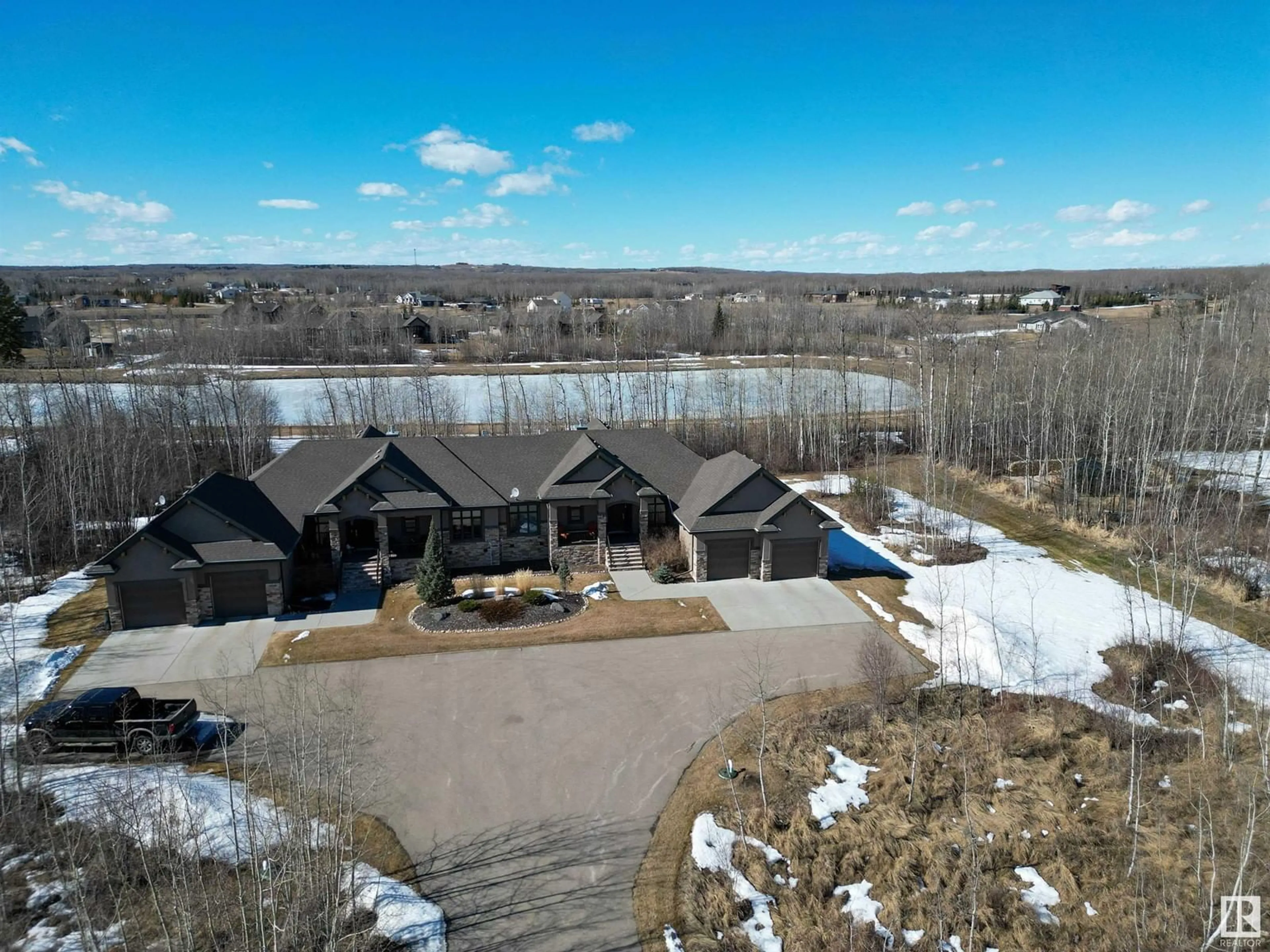 A pic from outside/outdoor area/front of a property/back of a property/a pic from drone, water/lake/river/ocean view for 15A RGE ROAD 272, Rural Parkland County Alberta T7X3M5