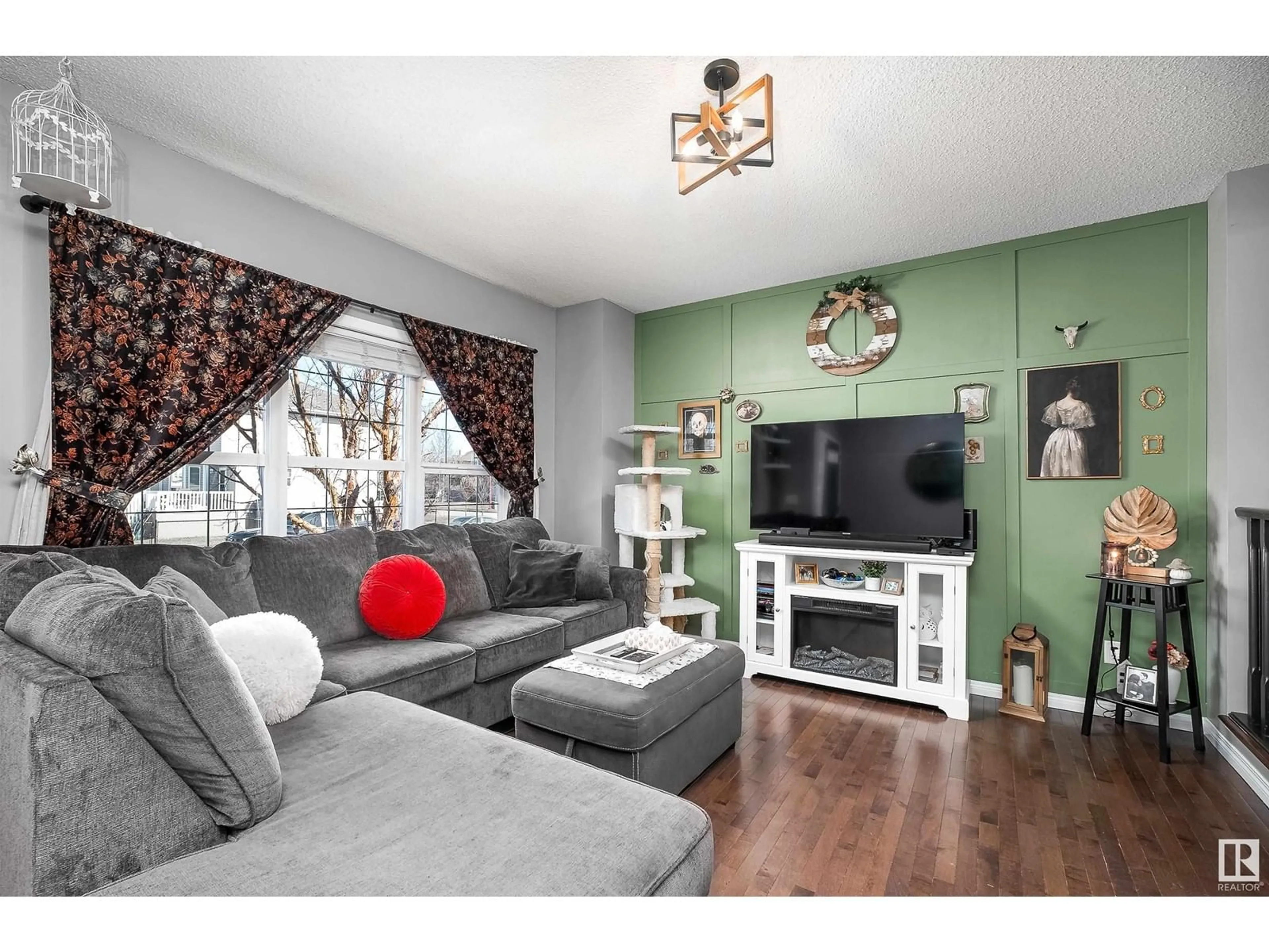 Living room with furniture, wood/laminate floor for 253 SOUTHWICK WY, Leduc Alberta T9E0G1