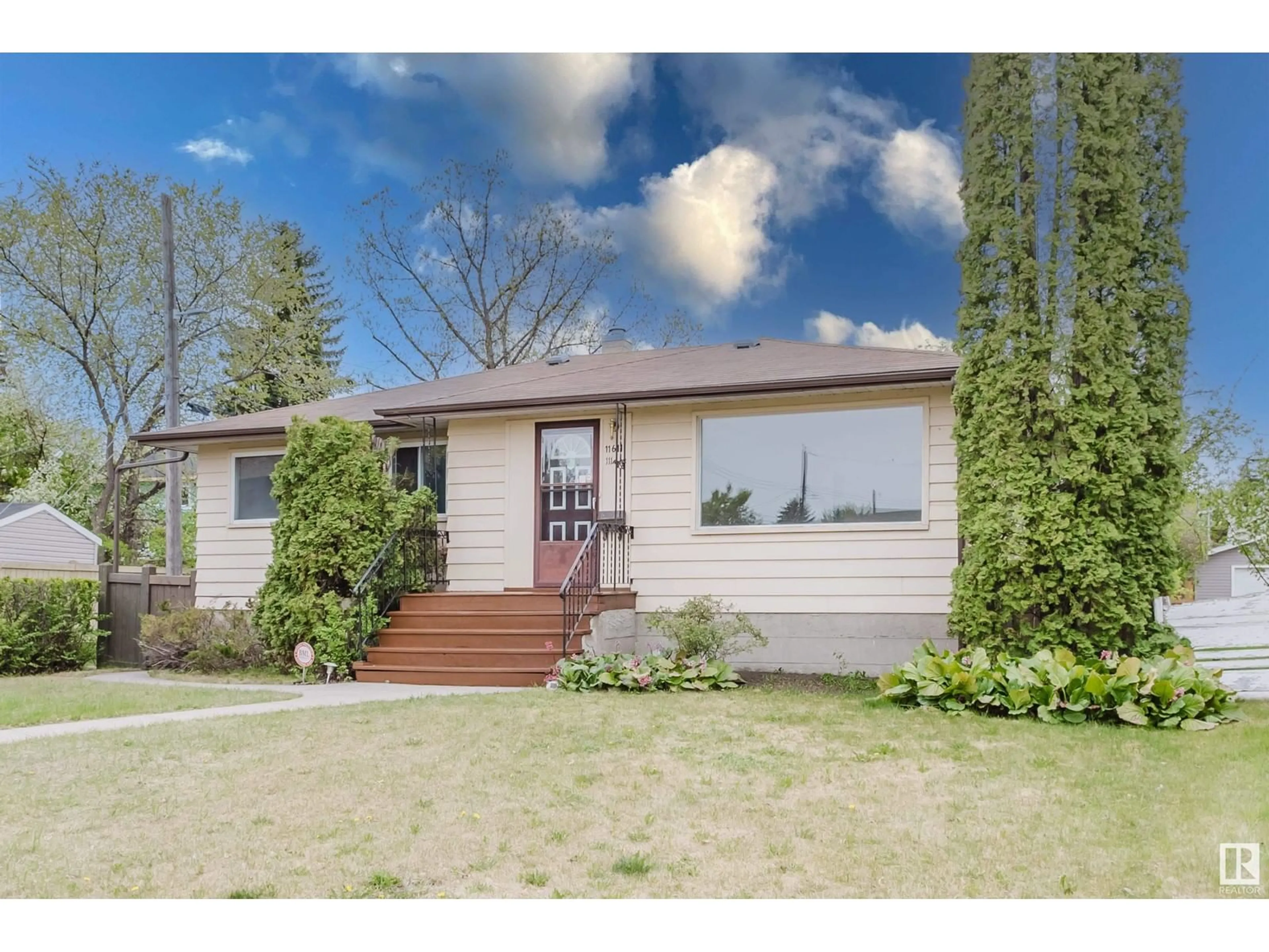 Home with vinyl exterior material, street for 11611 111A AV NW, Edmonton Alberta T5G0G2