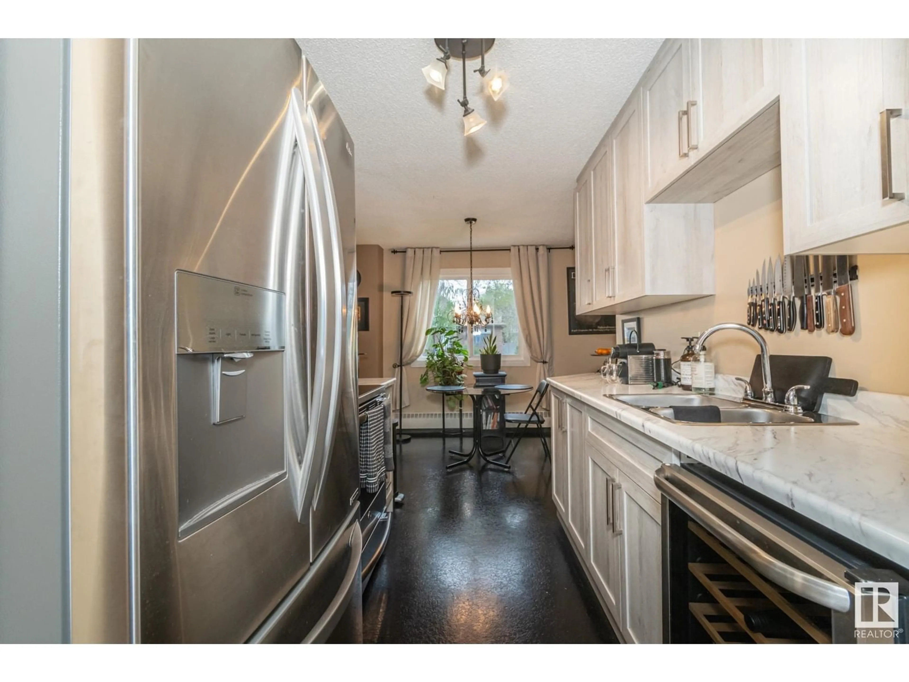 Open concept kitchen, unknown for #106 - 10842 107 ST, Edmonton Alberta T5H2Z3