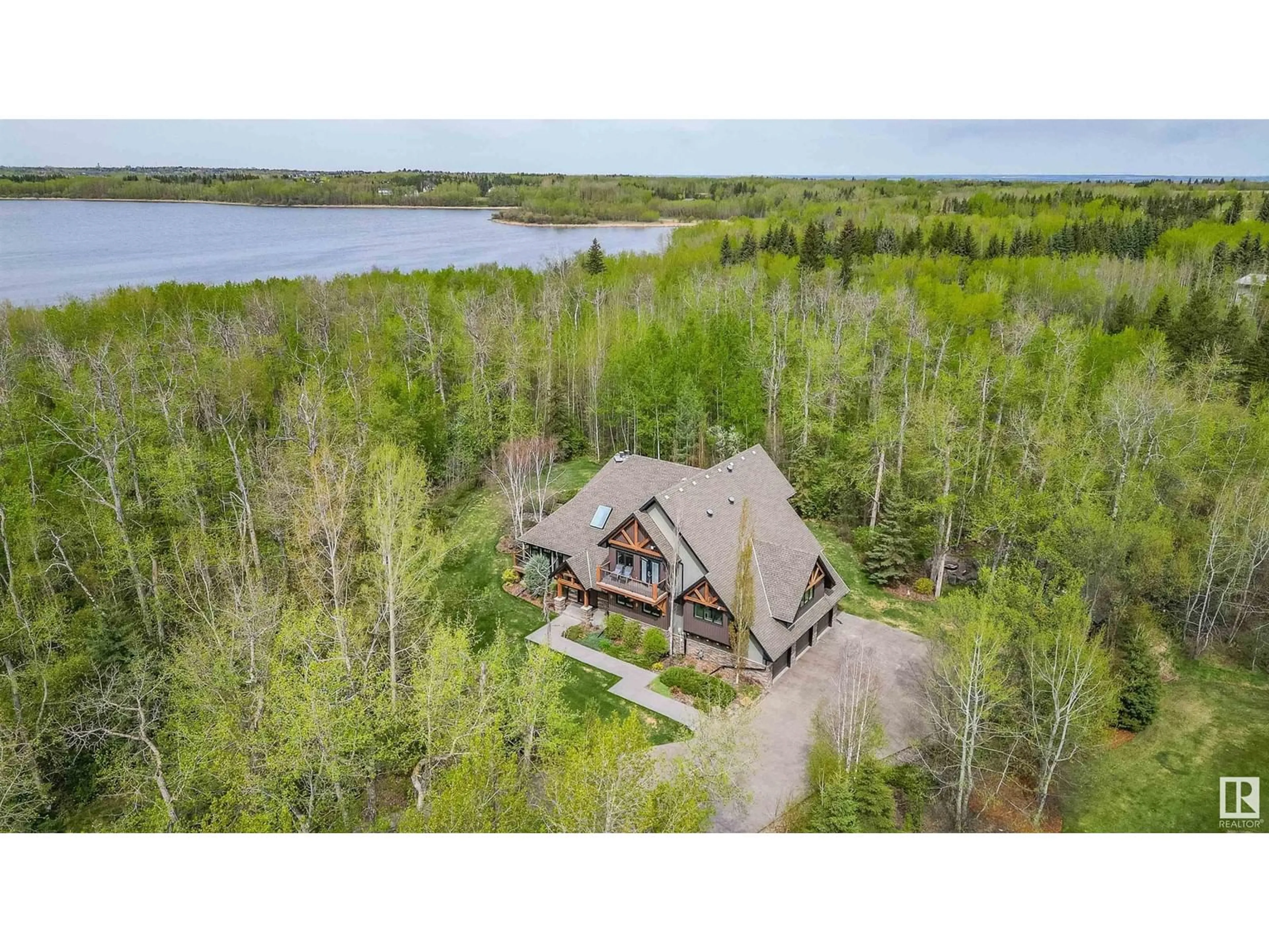A pic from outside/outdoor area/front of a property/back of a property/a pic from drone, water/lake/river/ocean view for 278 52422 RGE ROAD 224, Rural Strathcona County Alberta T8A6N1