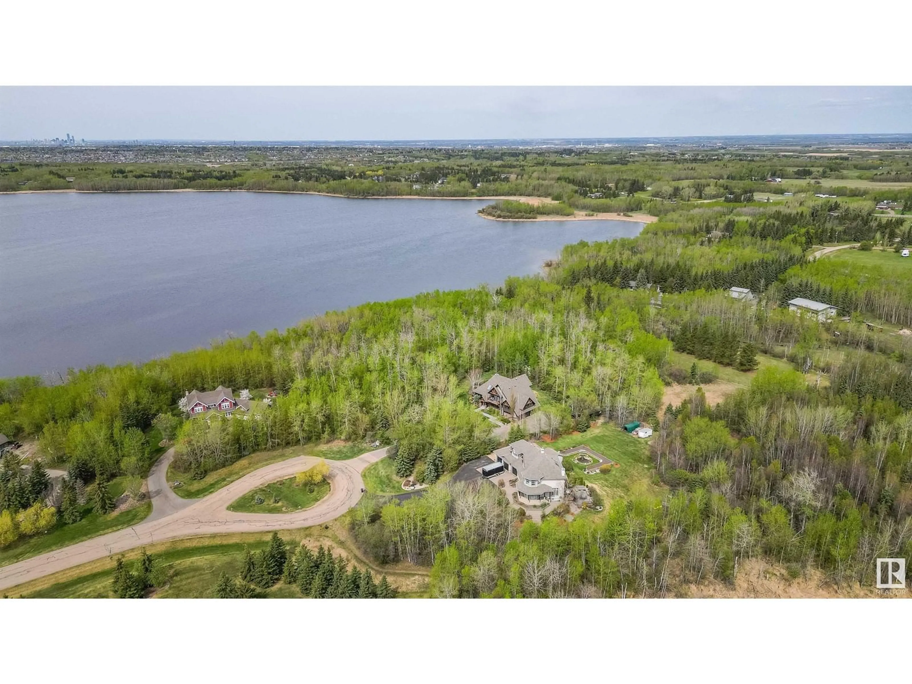 A pic from outside/outdoor area/front of a property/back of a property/a pic from drone, water/lake/river/ocean view for 278 52422 RGE ROAD 224, Rural Strathcona County Alberta T8A6N1