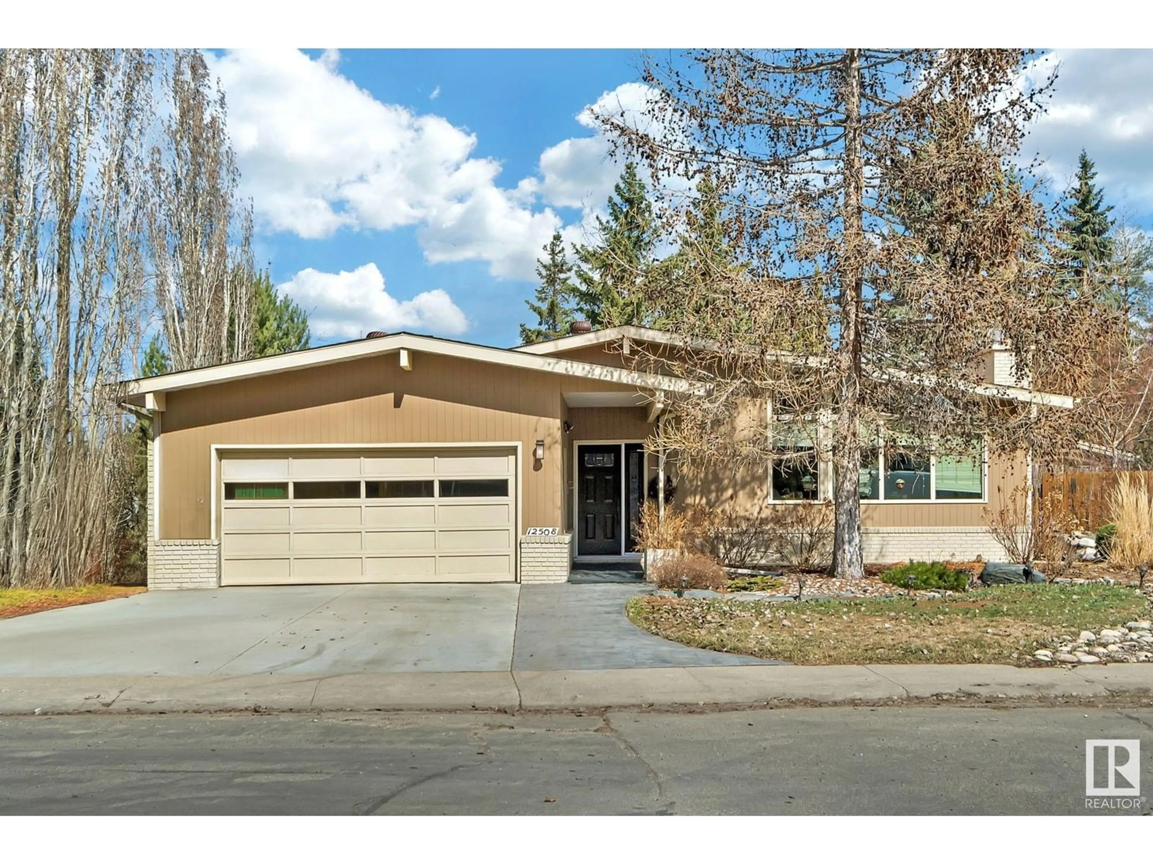 Home with vinyl exterior material, street for NW - 12508 42 AV, Edmonton Alberta T6J0X3