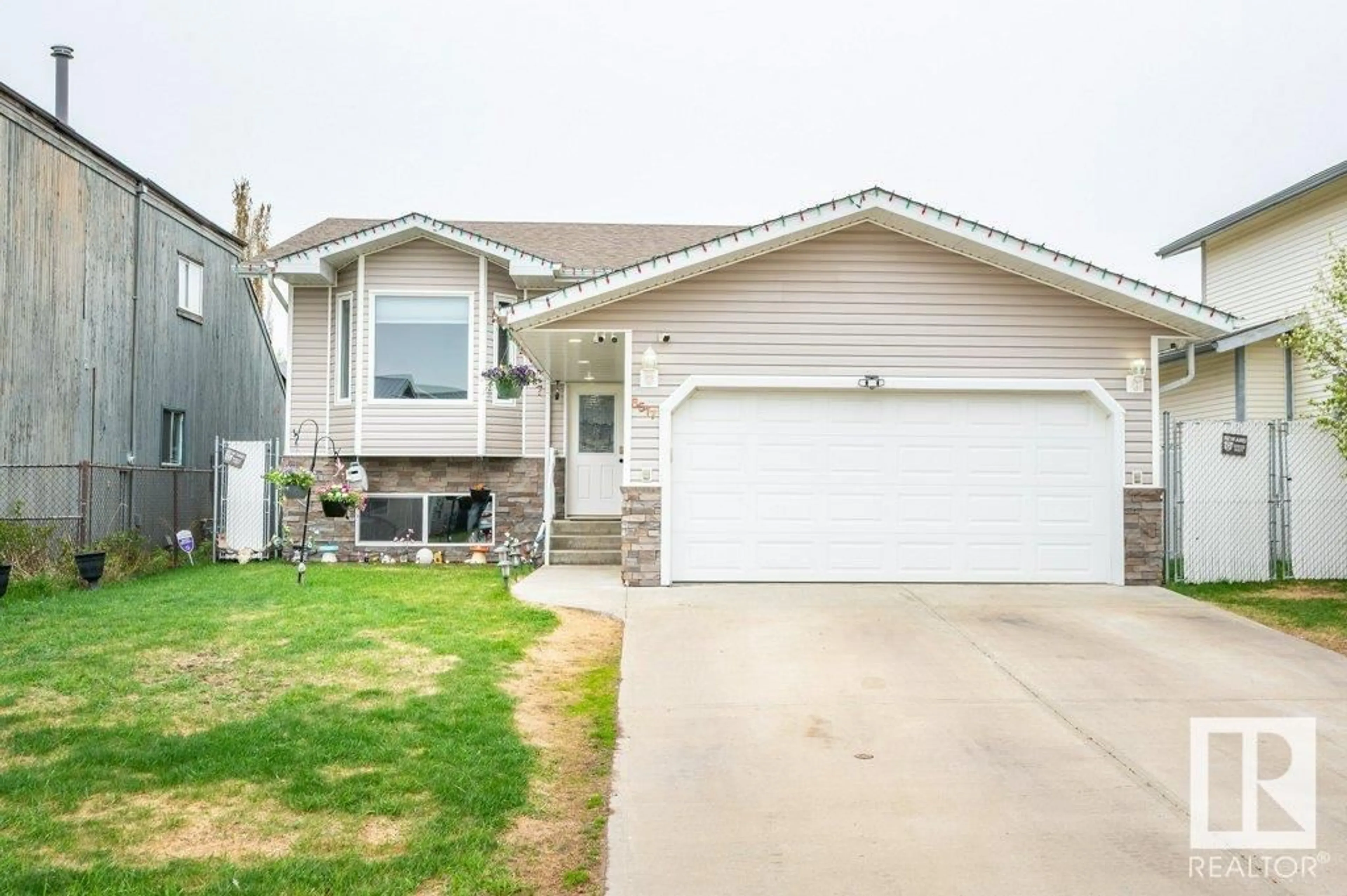 Home with vinyl exterior material, street for 6517 53 AV, Redwater Alberta T0A2W0