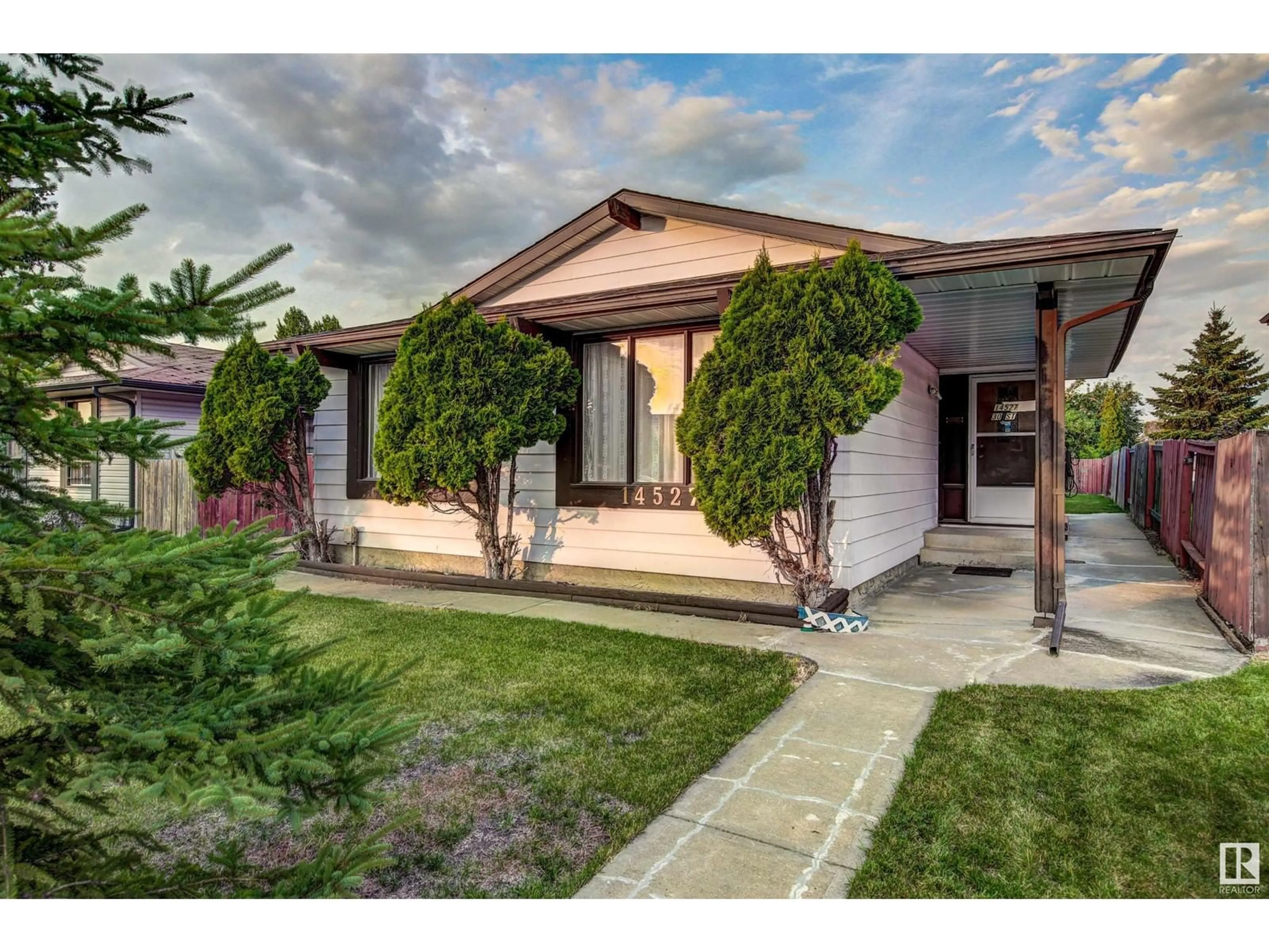 Home with vinyl exterior material, street for 14527 30 ST, Edmonton Alberta T5Y2C4