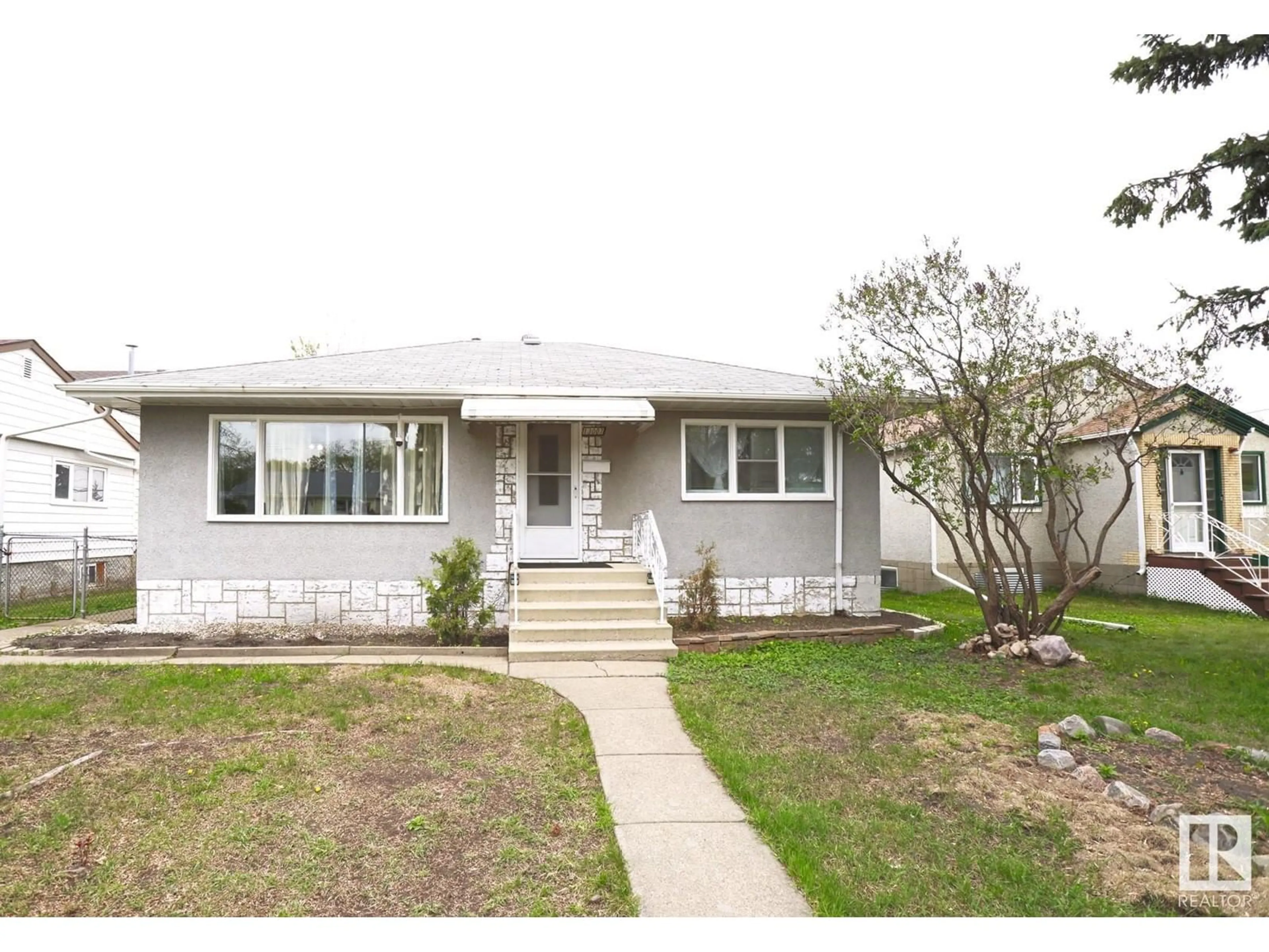 Home with vinyl exterior material, street for 13007 63 ST, Edmonton Alberta T5A0W5