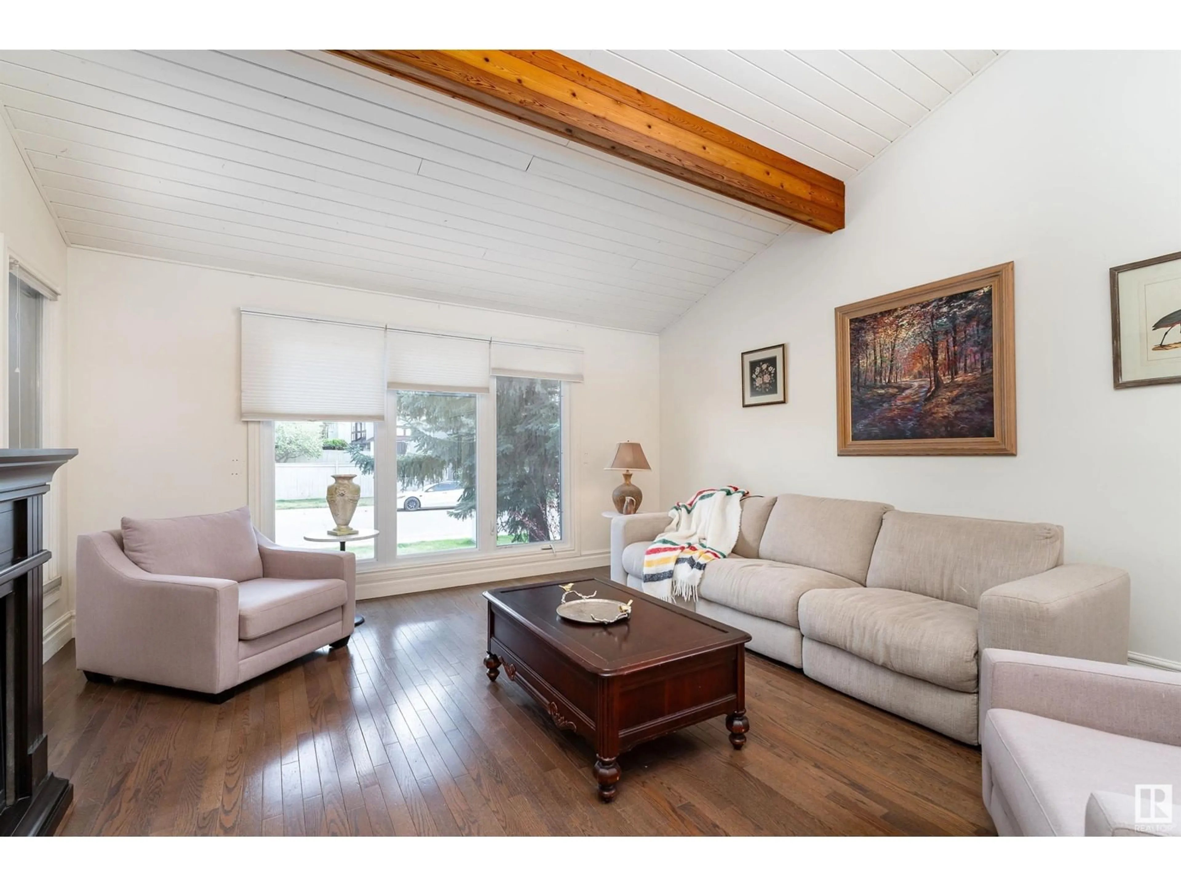 Living room with furniture, wood/laminate floor for 10564 17 AV, Edmonton Alberta T6J5B5