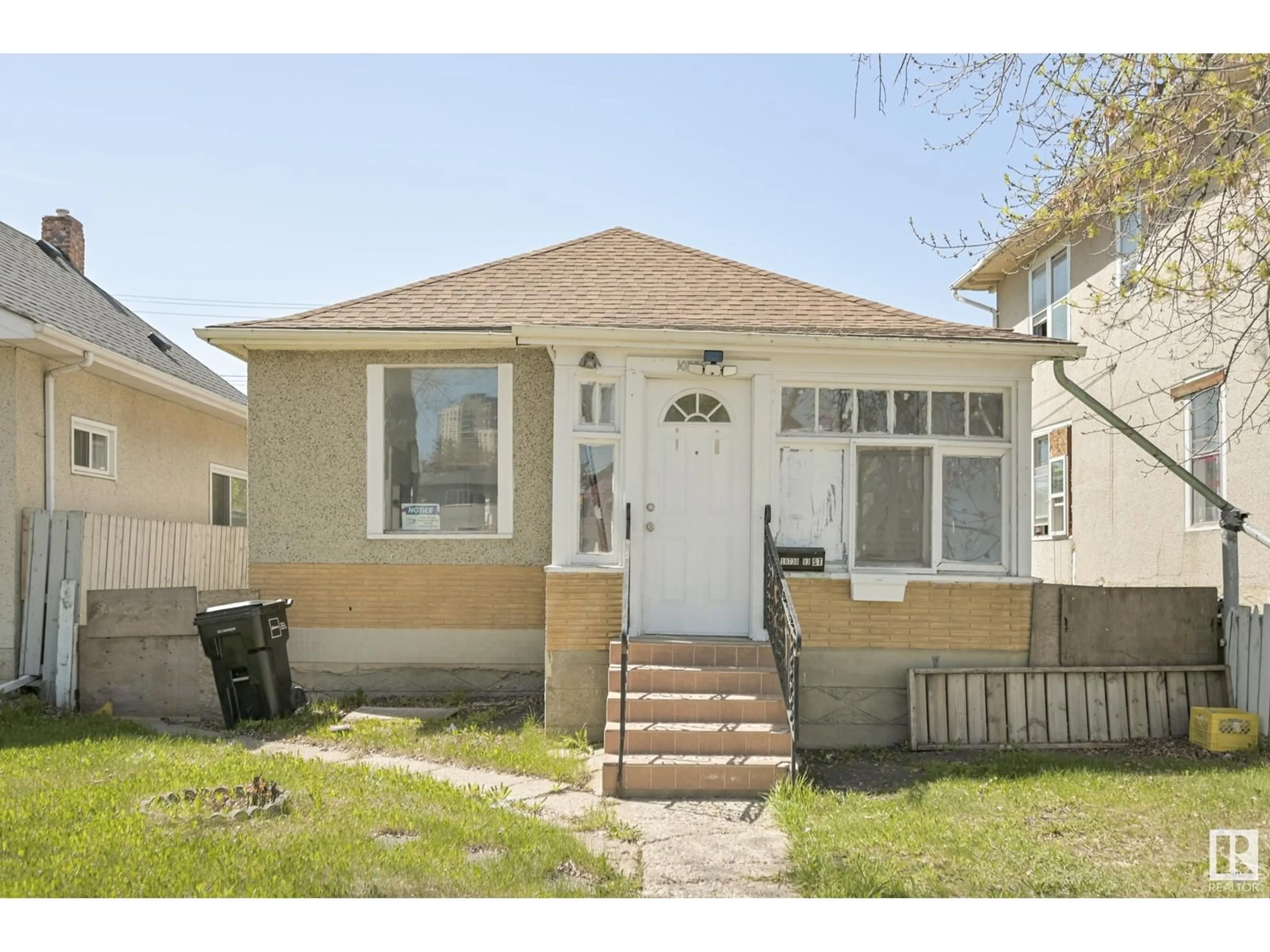 Home with vinyl exterior material, street for NW - 10730 93 ST, Edmonton Alberta T5H1Y3