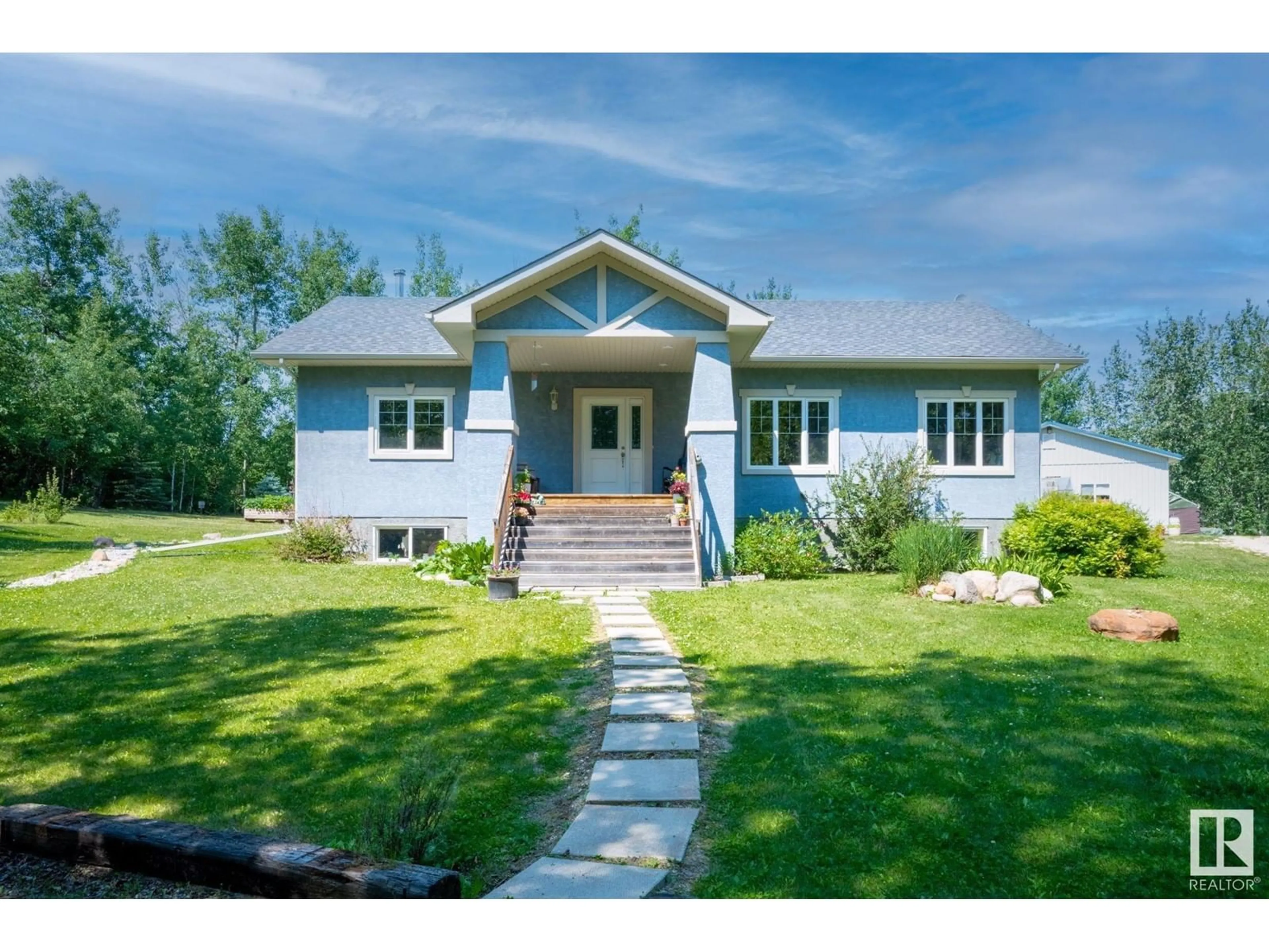 Home with vinyl exterior material, street for 54419 RGE RD 14, Rural Lac Ste. Anne County Alberta T0E1V0
