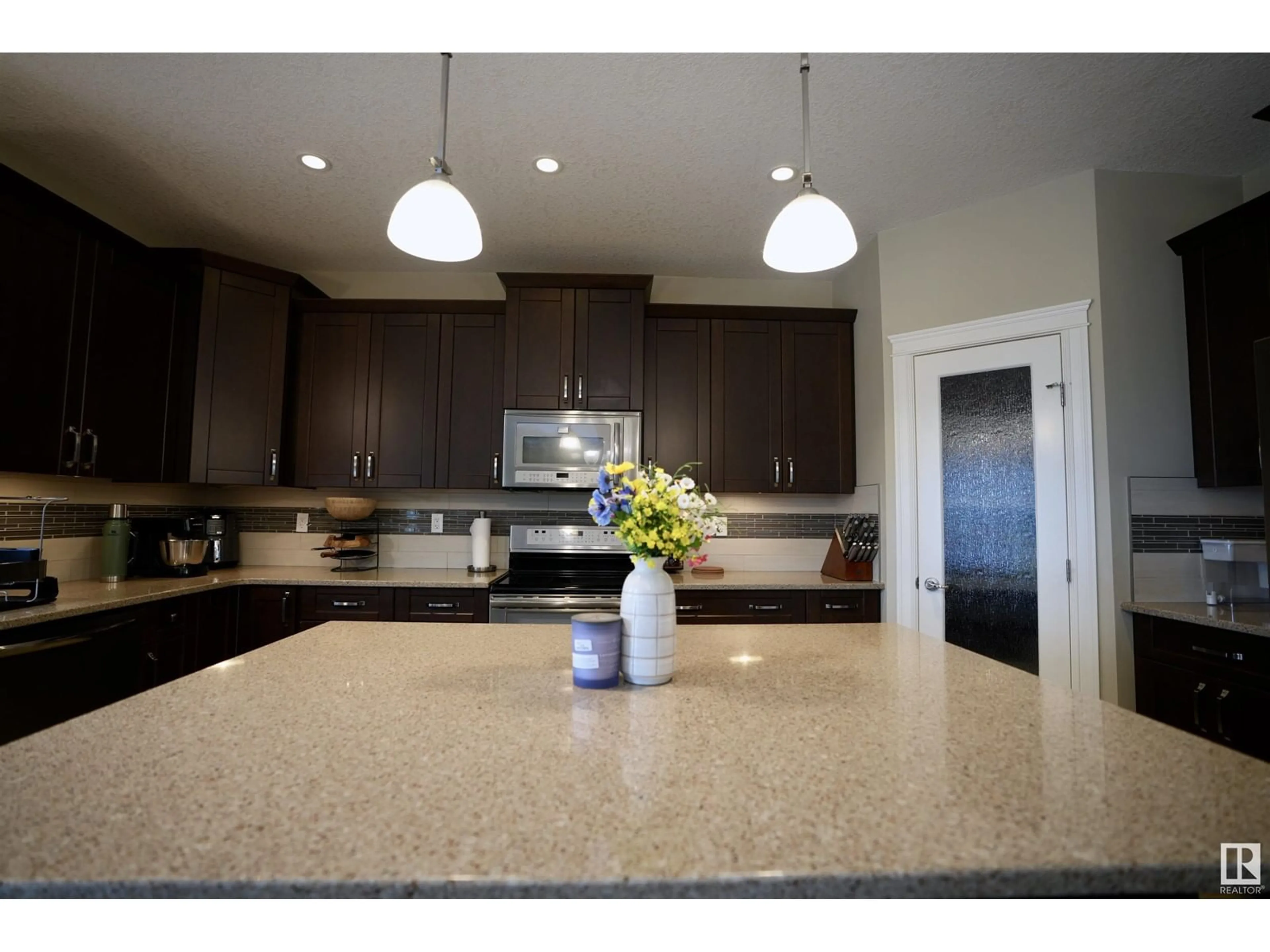 Open concept kitchen, ceramic/tile floor for 101 46225 TWP RD 612, Rural Bonnyville M.D. Alberta T9N2G8