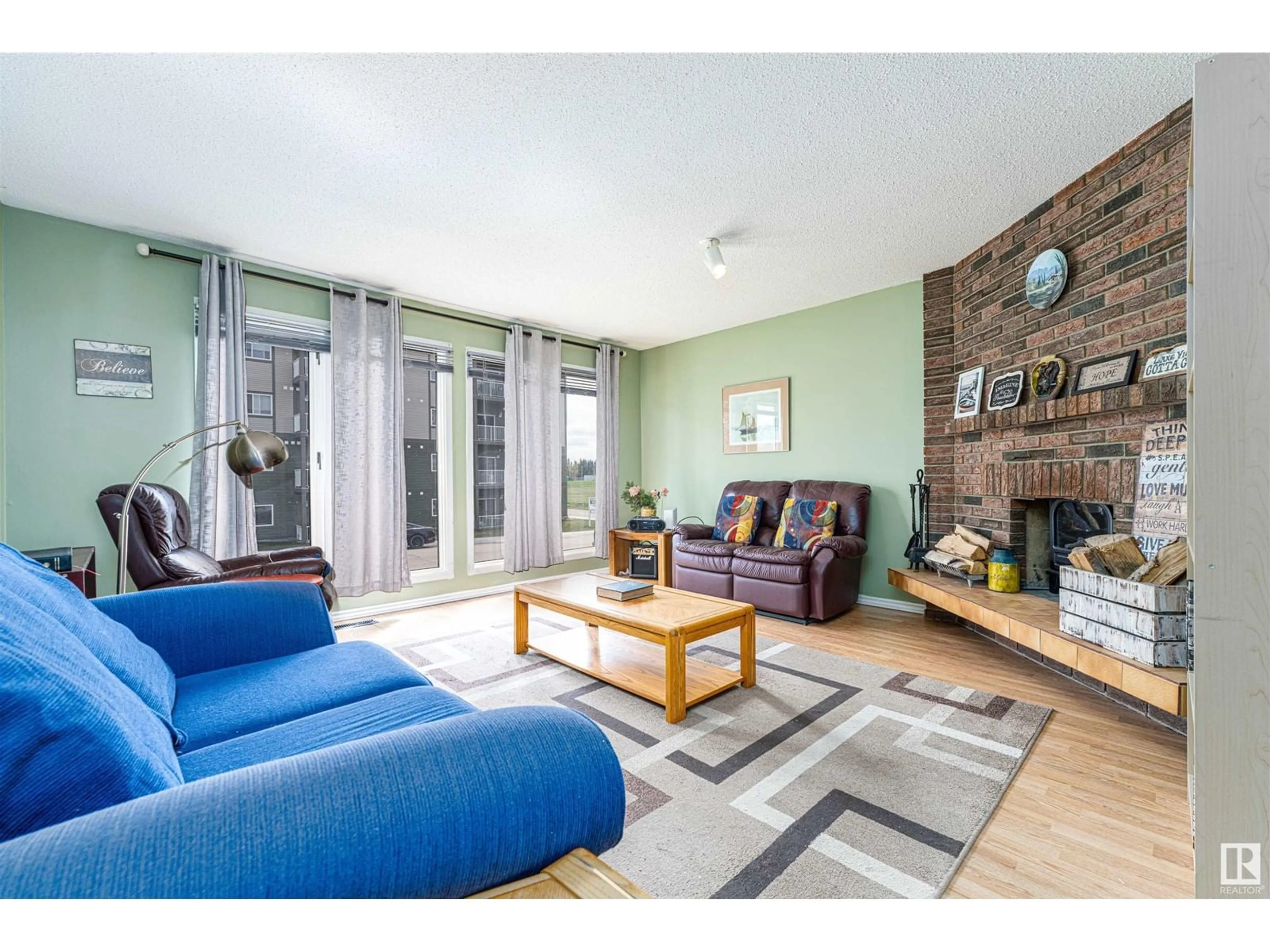 Living room with furniture, wood/laminate floor for 4708 56 AV, Bruderheim Alberta T0B0S0