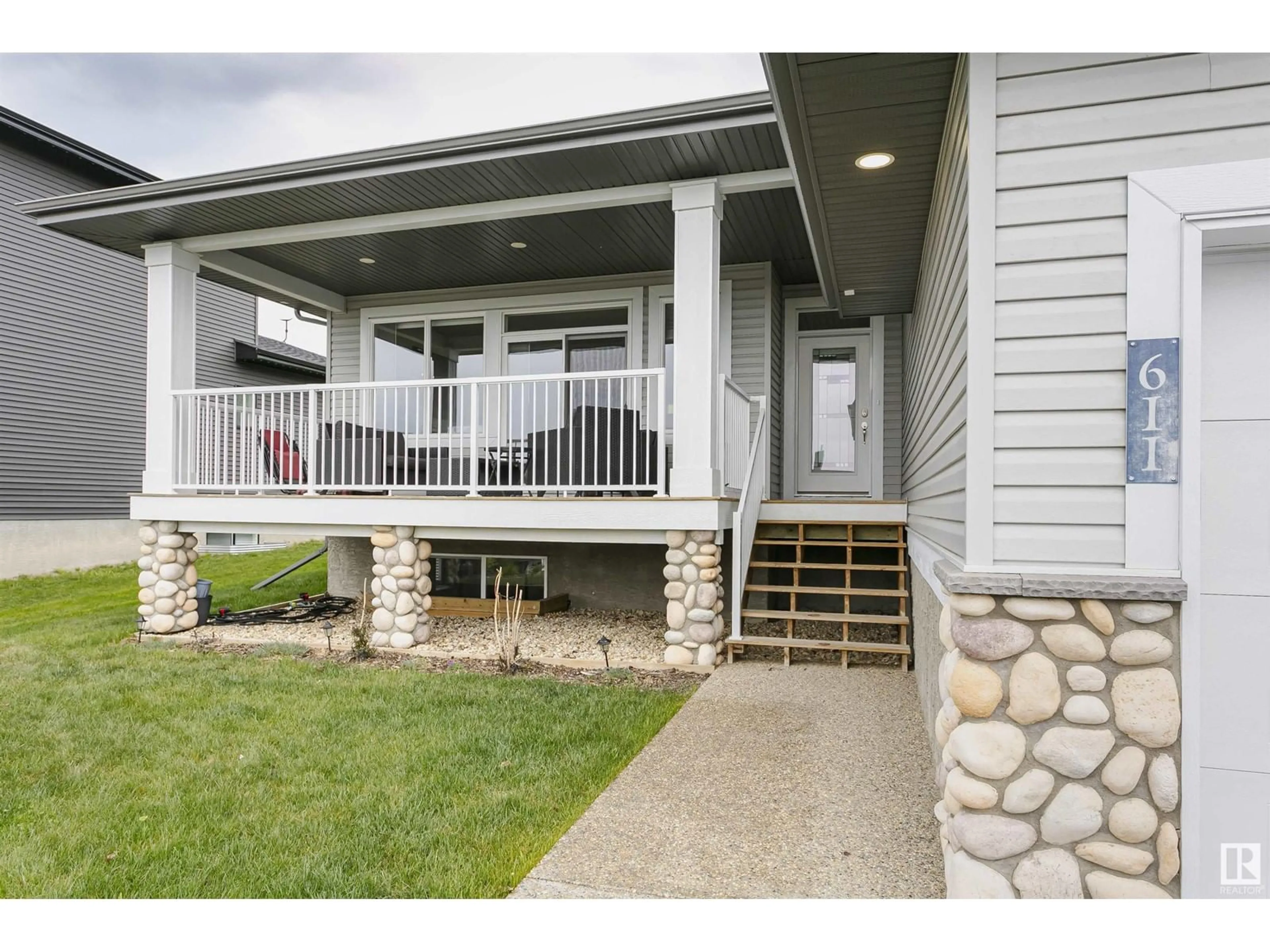 Home with vinyl exterior material, street for 611 55101 STE ANNE TRAIL, Rural Lac Ste. Anne County Alberta T0E1A1