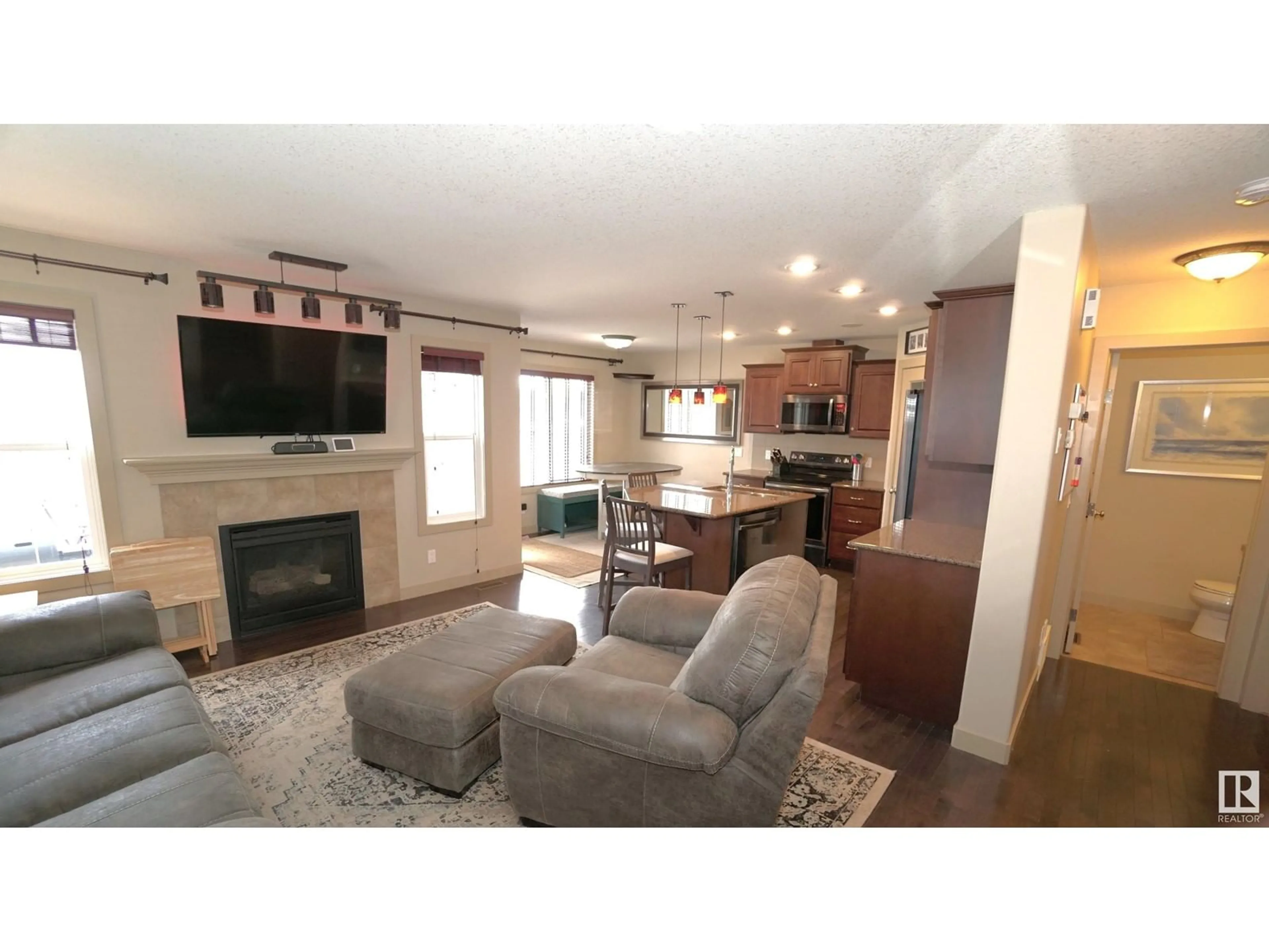 Living room with furniture, wood/laminate floor for NW - 3863 GALLINGER LO, Edmonton Alberta T5T4G7