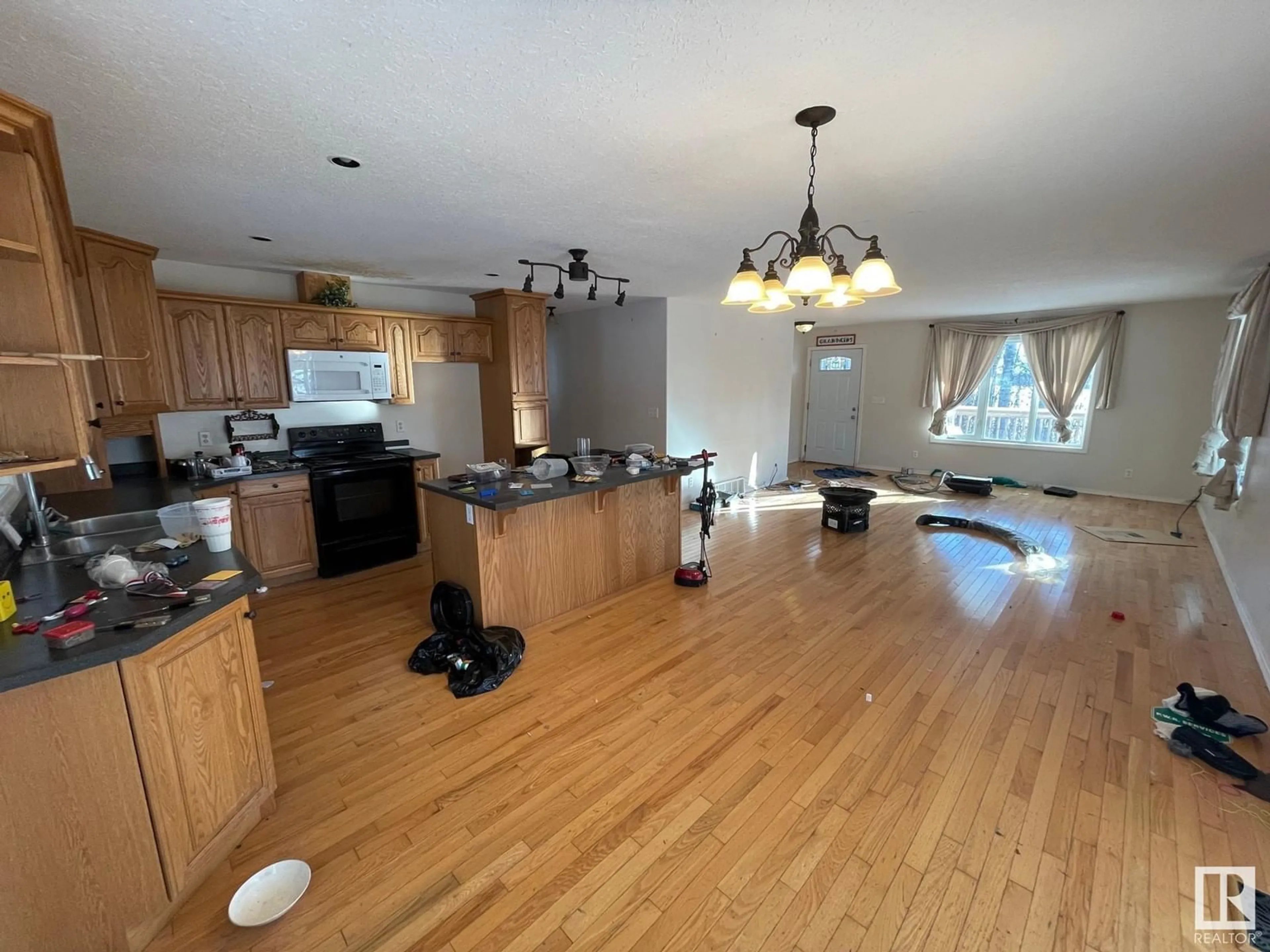 Open concept kitchen, wood/laminate floor for 63303 - 137 HWY 867 HWY, Rural Lac La Biche County Alberta T9E5M1
