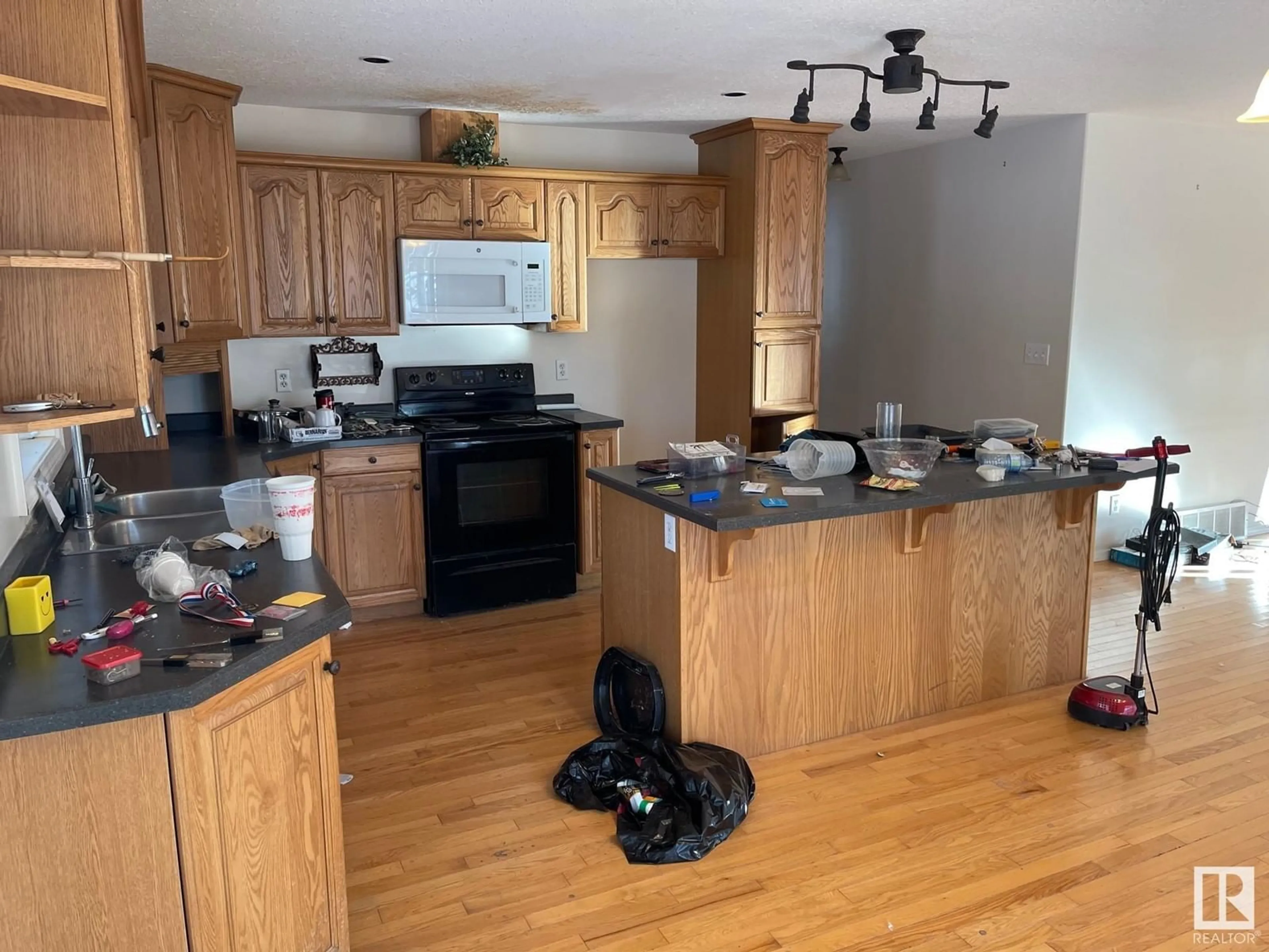 Open concept kitchen, wood/laminate floor for 63303 - 137 HWY 867 HWY, Rural Lac La Biche County Alberta T9E5M1