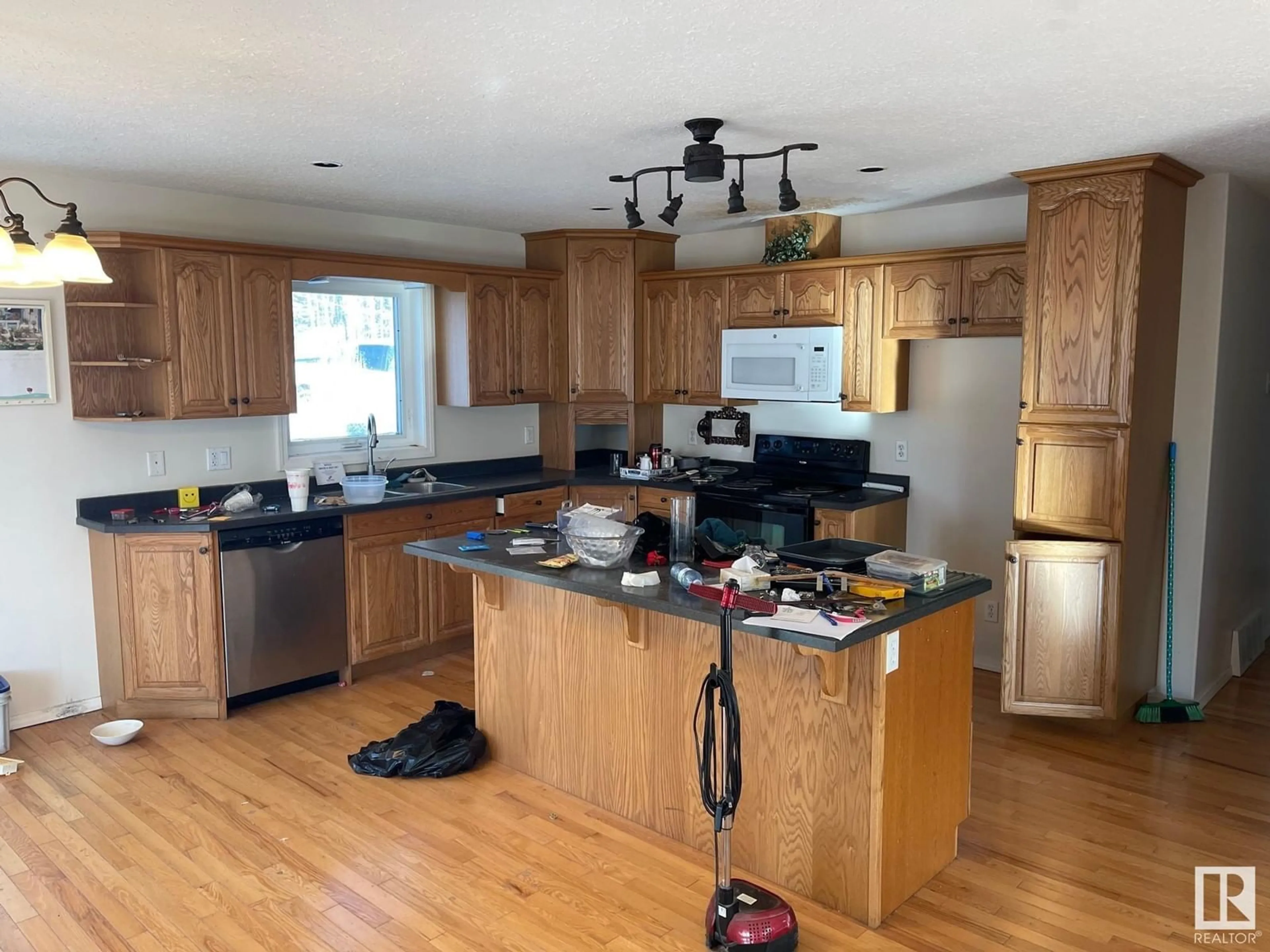 Open concept kitchen, wood/laminate floor for 63303 - 137 HWY 867 HWY, Rural Lac La Biche County Alberta T9E5M1