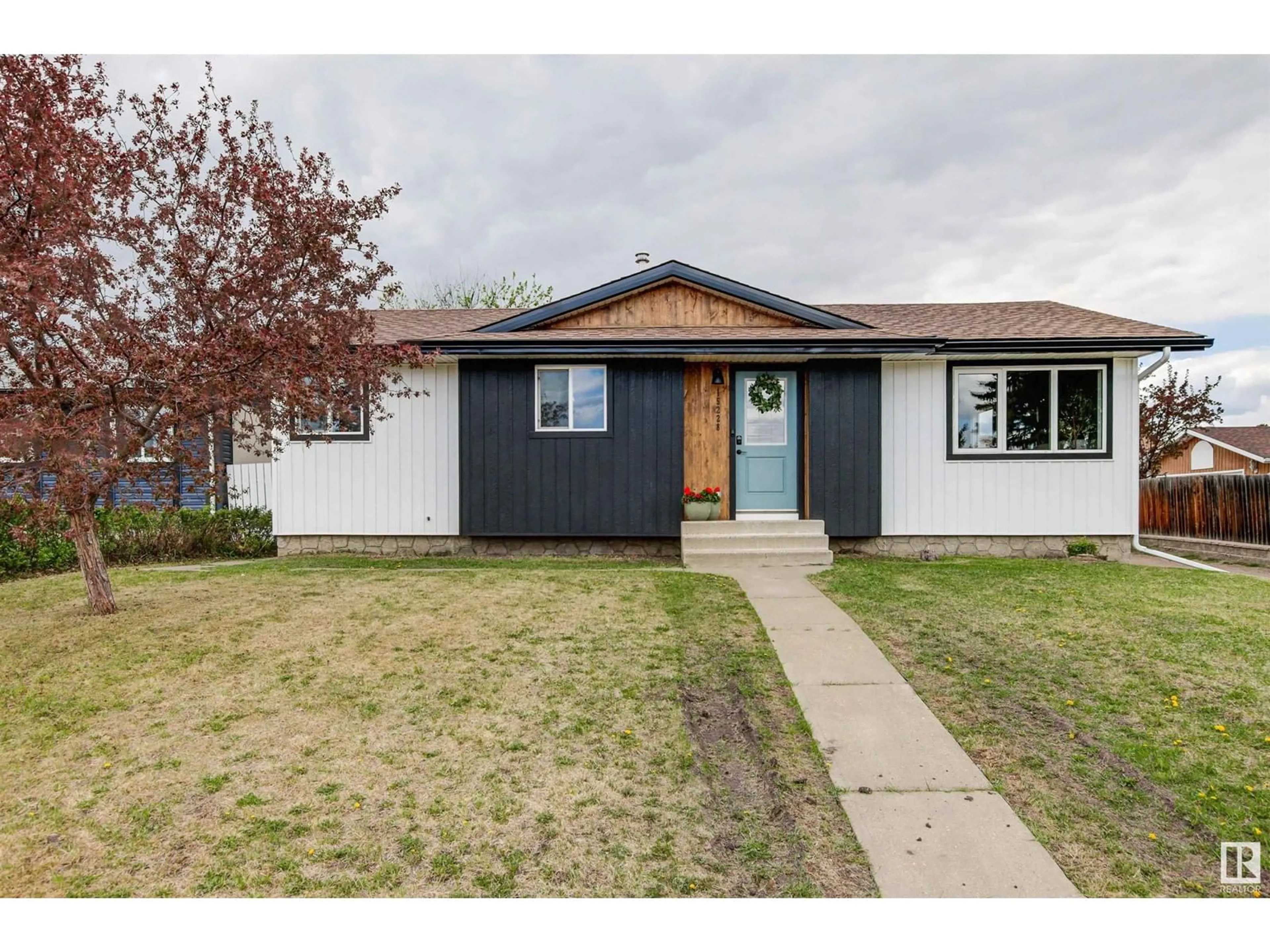 Home with vinyl exterior material, street for 15228 116 ST, Edmonton Alberta T5X1J6