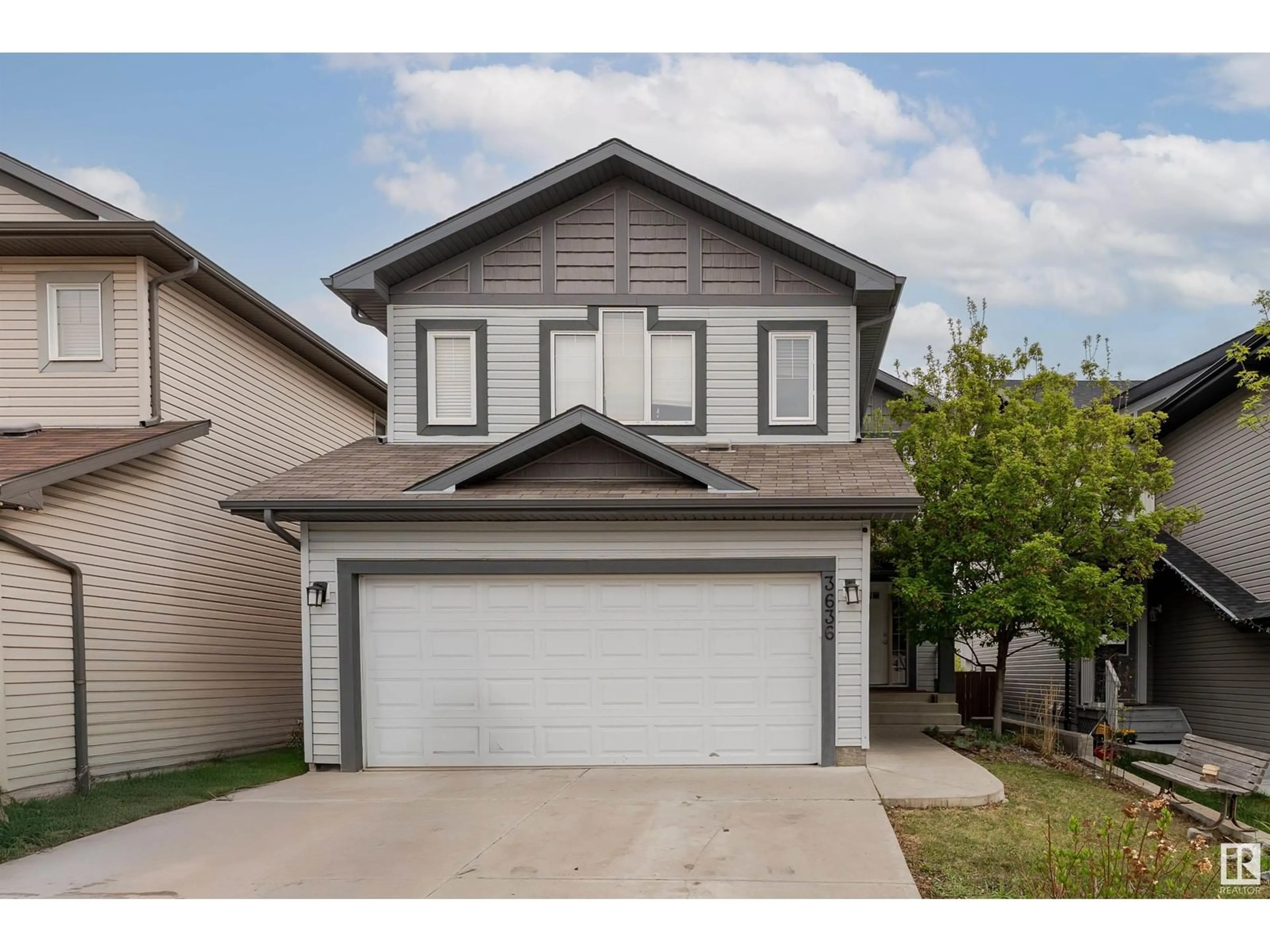 Home with vinyl exterior material, street for 3636 166 AV, Edmonton Alberta T5Y0N8