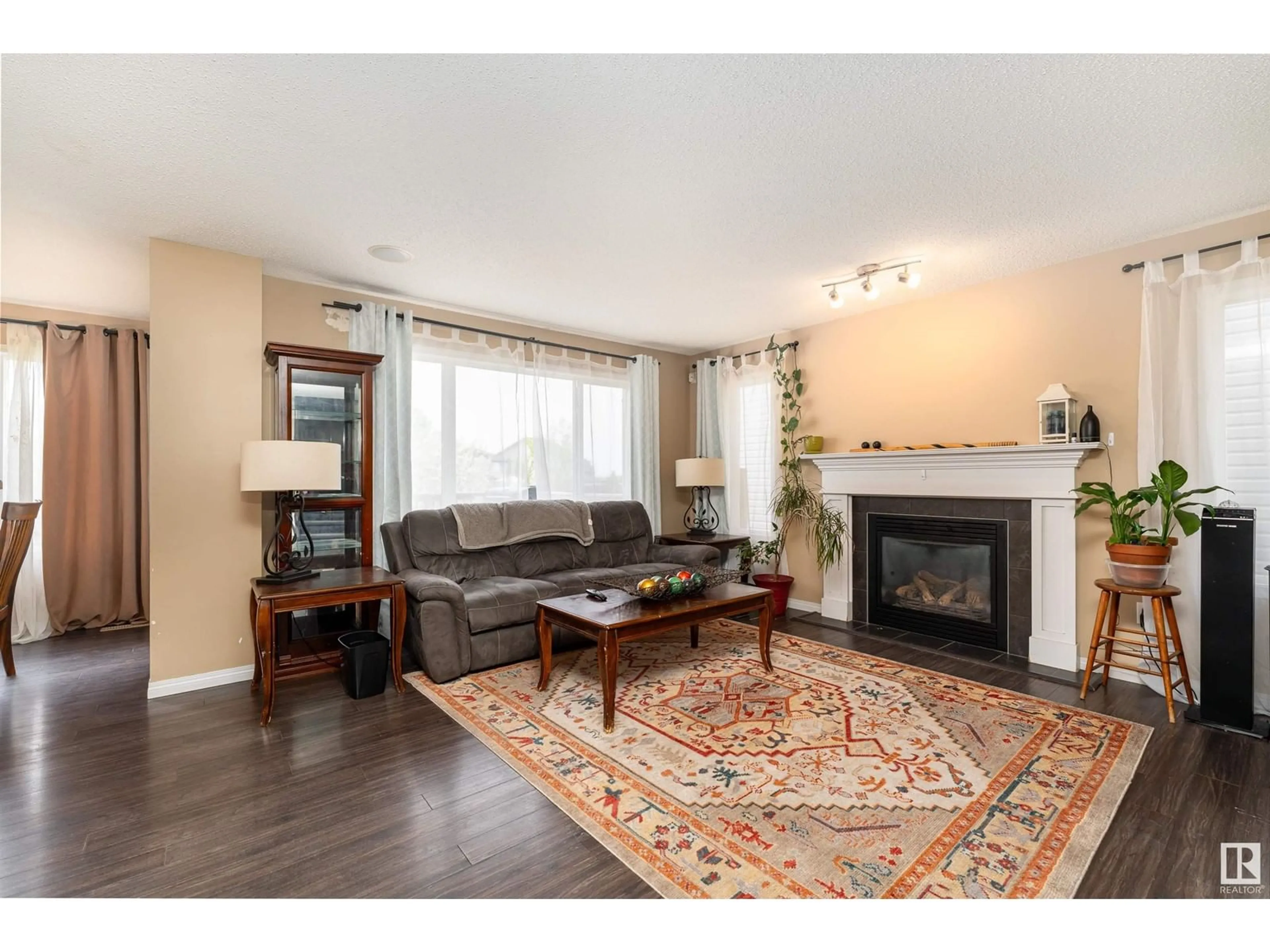 Living room with furniture, wood/laminate floor for 3636 166 AV, Edmonton Alberta T5Y0N8