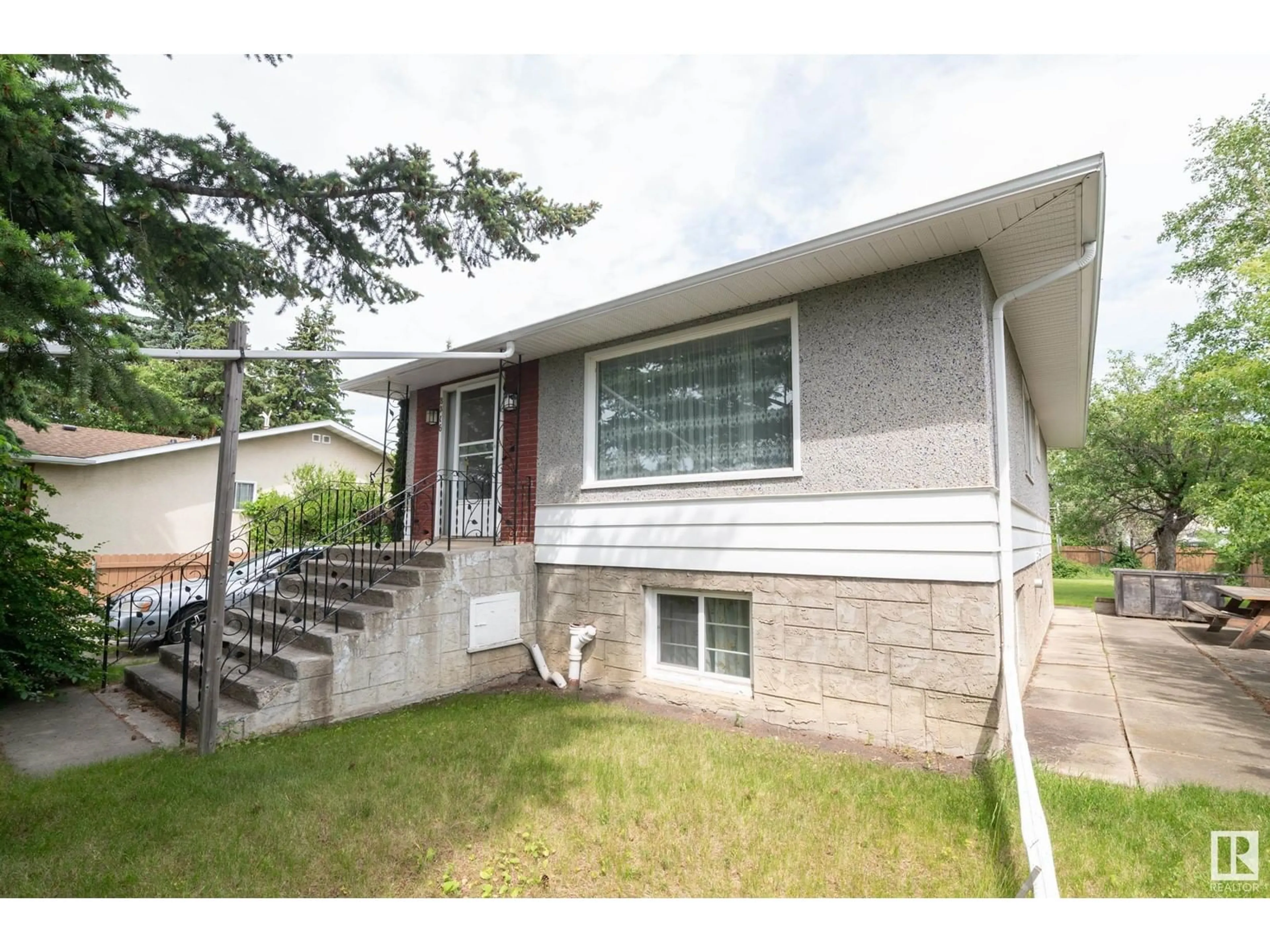 Home with vinyl exterior material, street for NW - 8316 73 AV, Edmonton Alberta T6C0E2