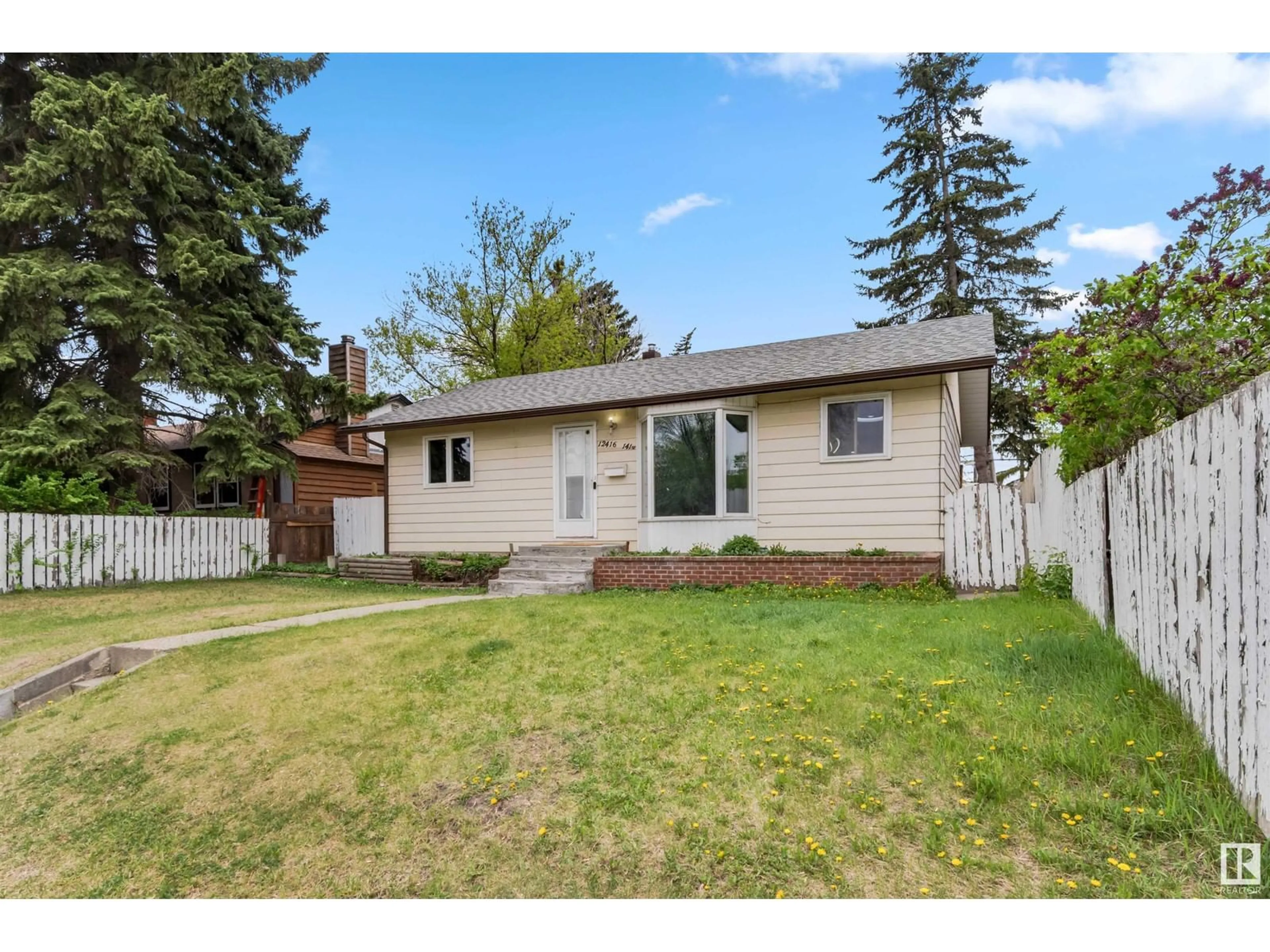 Home with vinyl exterior material, street for NW - 12416 141 ST, Edmonton Alberta T5L2G5