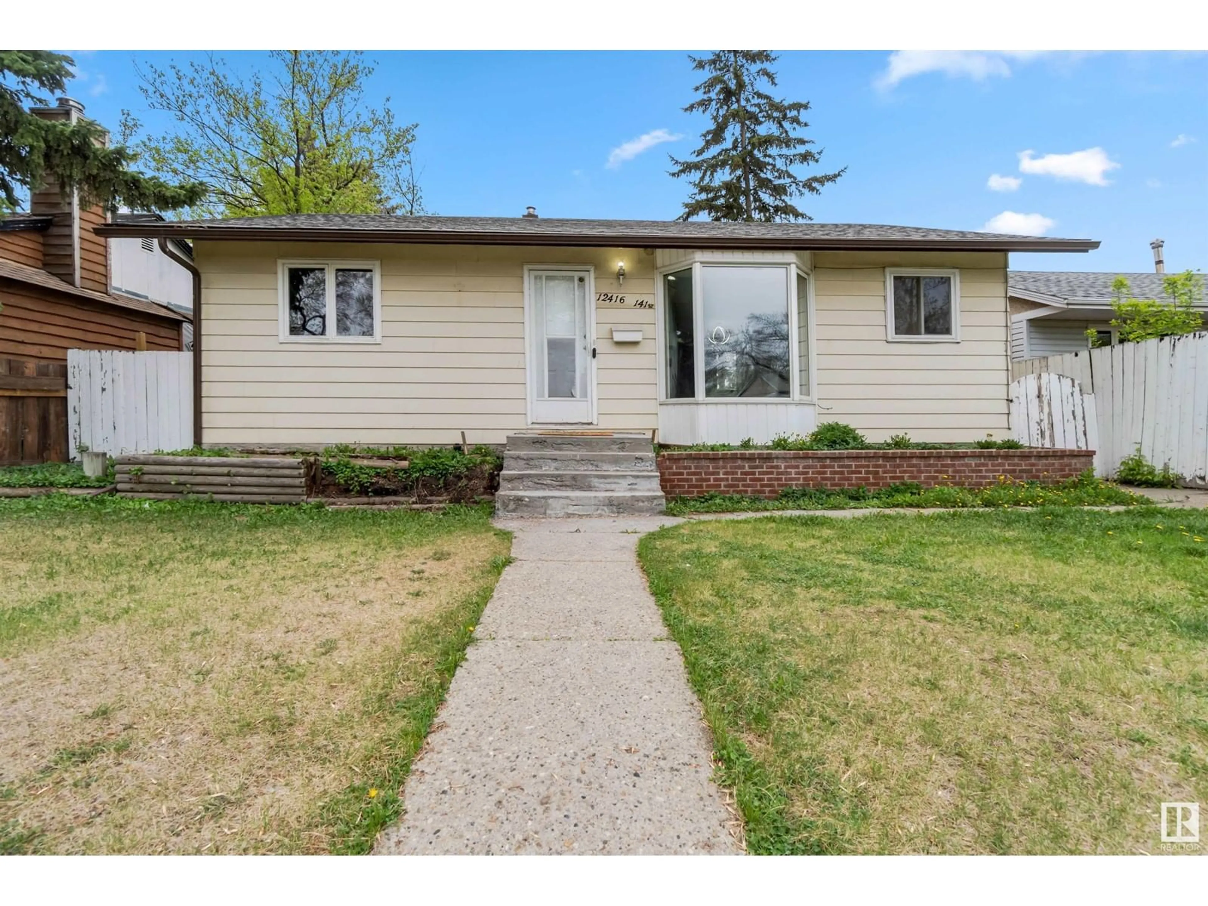 Home with vinyl exterior material, street for NW - 12416 141 ST, Edmonton Alberta T5L2G5