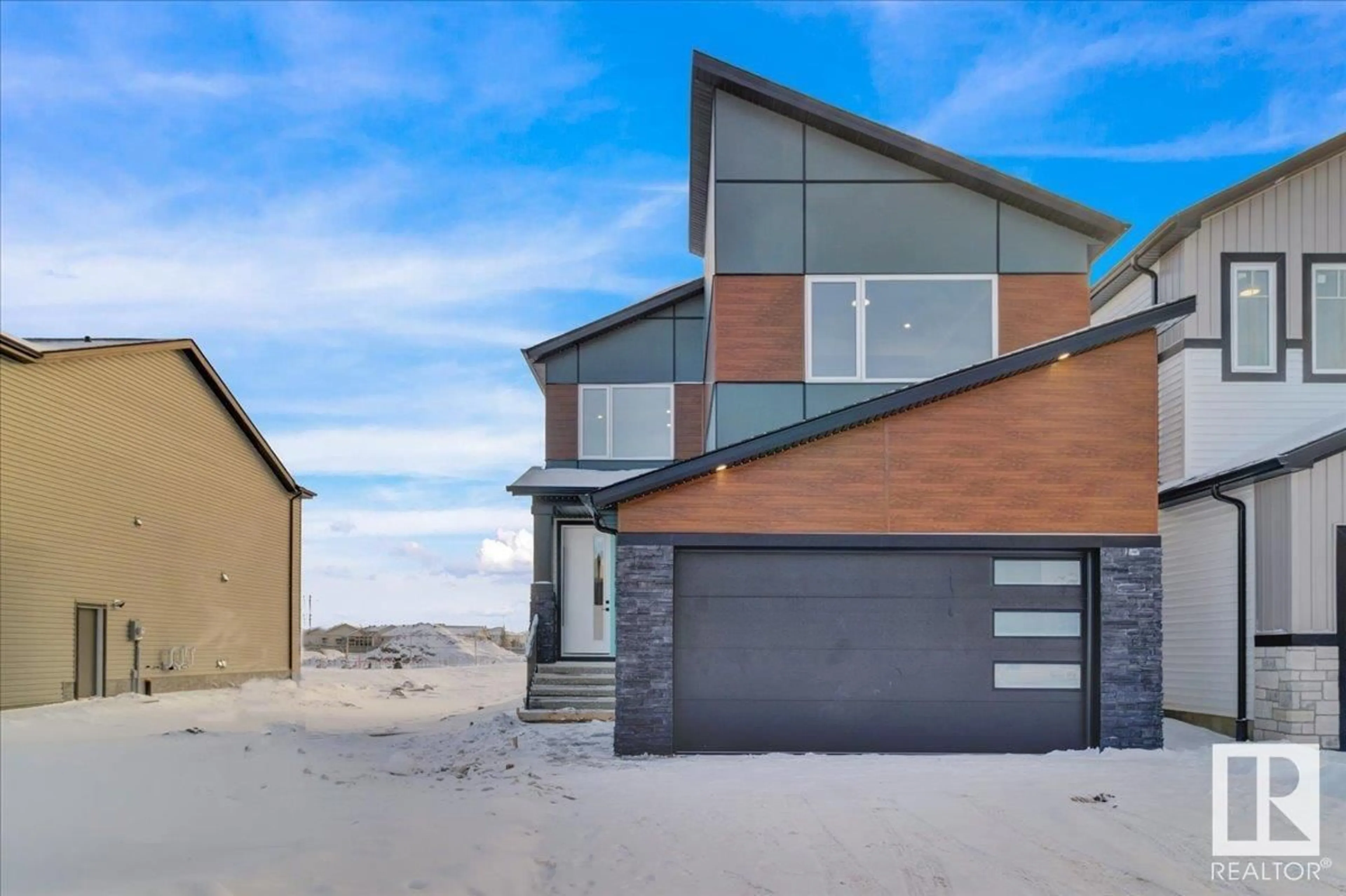 Home with brick exterior material, street for 7007 169 AV, Edmonton Alberta T5Z0H2