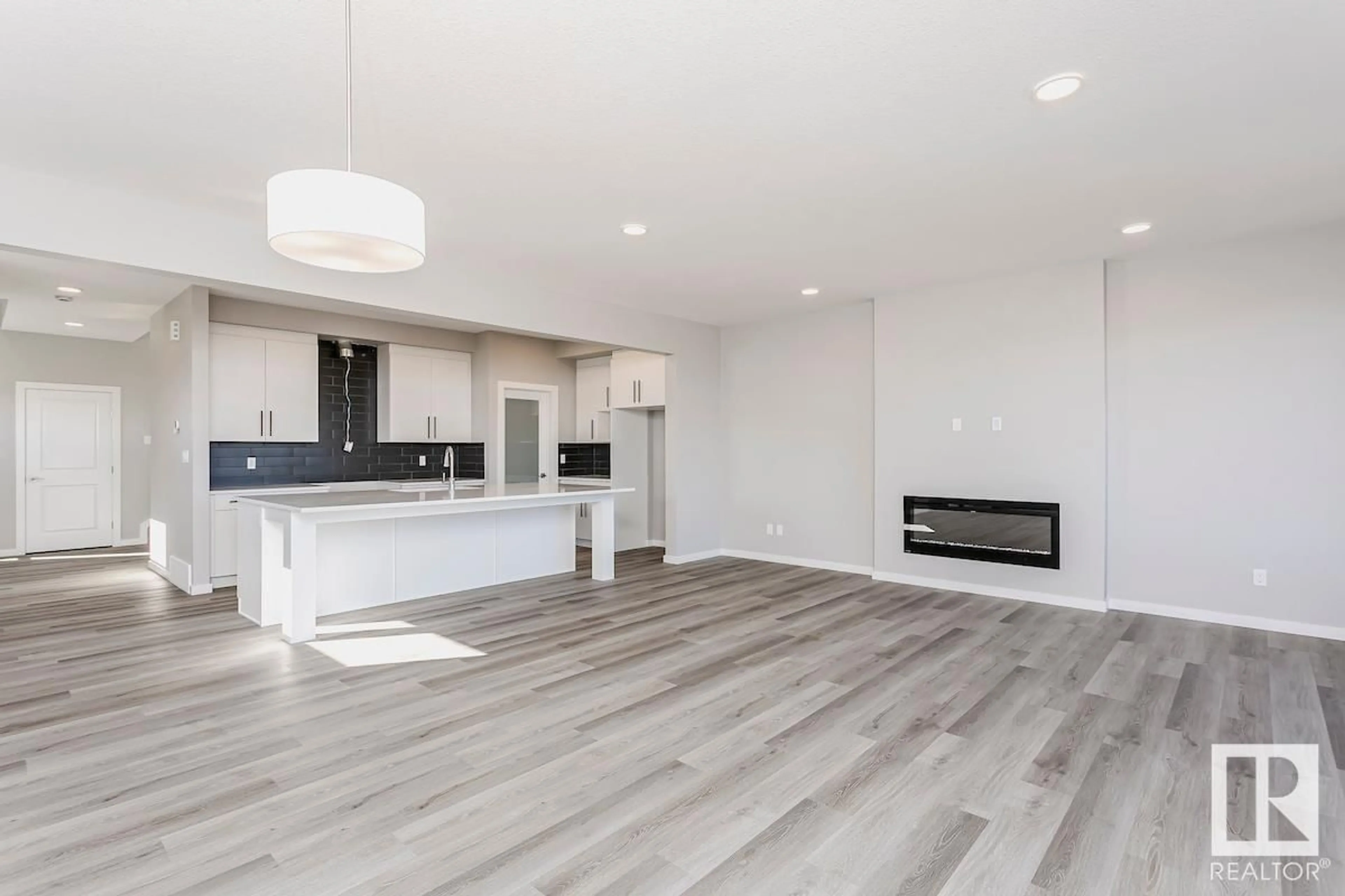 Open concept kitchen, wood/laminate floor for 44 GAMBEL LO, Spruce Grove Alberta T7X0C9
