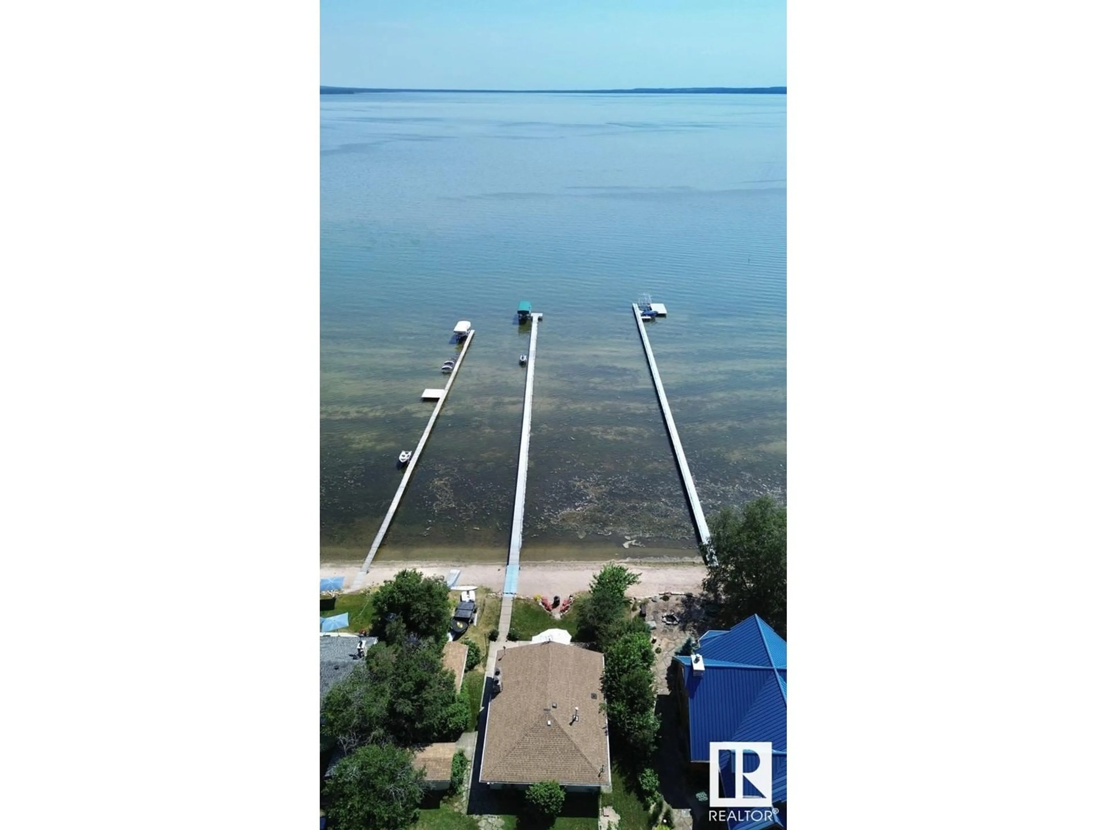 A pic from outside/outdoor area/front of a property/back of a property/a pic from drone, water/lake/river/ocean view for 61 ARGENTIA BE, Rural Wetaskiwin County Alberta T0C2C0