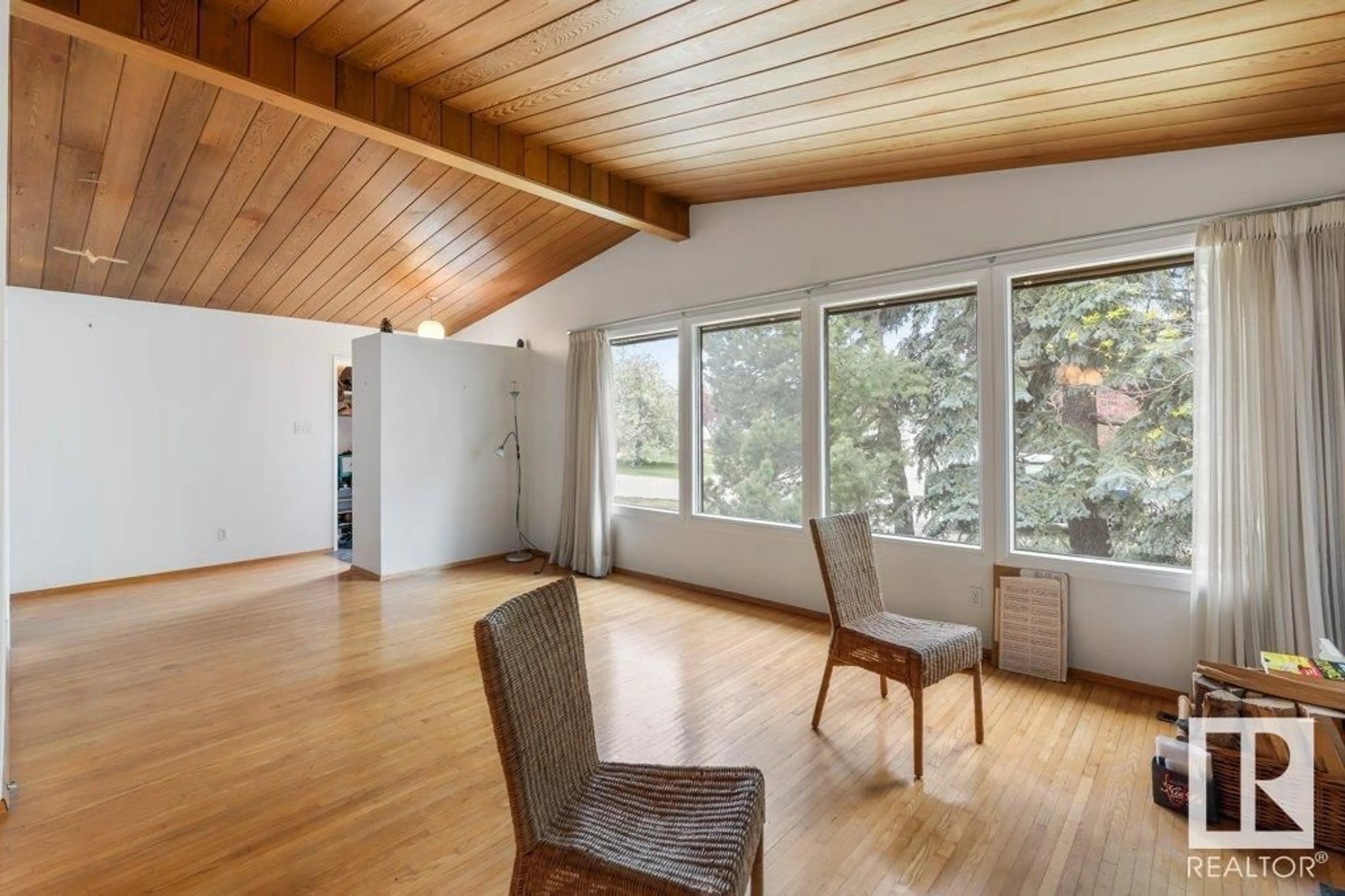 Living room with furniture, wood/laminate floor for 11404 44 AV, Edmonton Alberta T6J0Z2