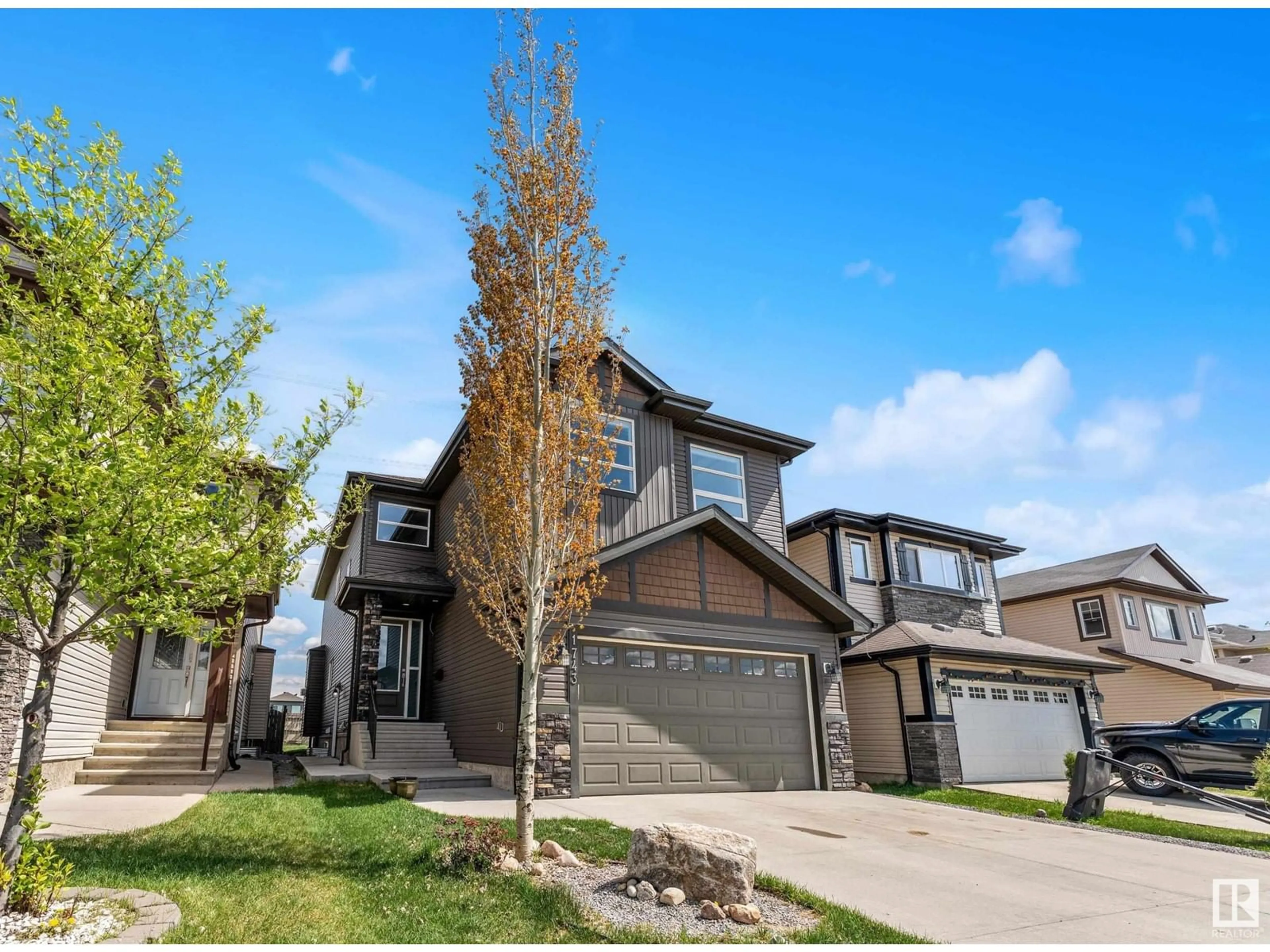 Home with vinyl exterior material, street for 1743 28 ST, Edmonton Alberta T6T0Z6
