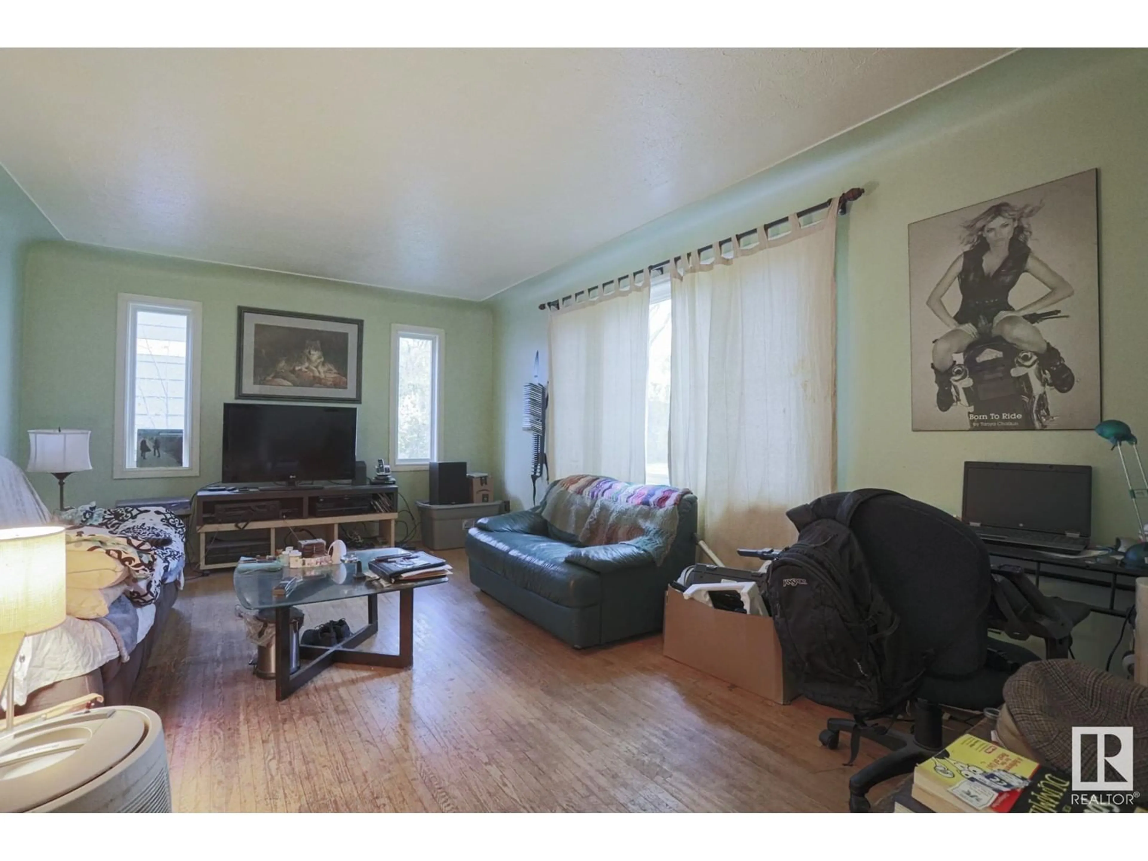 Living room with furniture, wood/laminate floor for 11207 71 AV, Edmonton Alberta T6G0A1