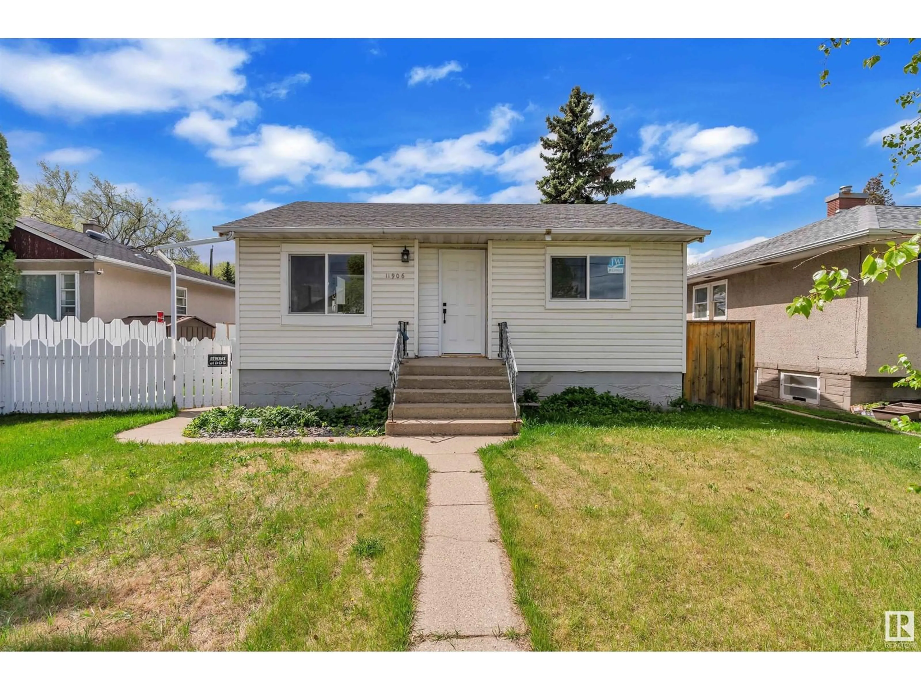 Home with vinyl exterior material, street for NW - 11906 50 ST, Edmonton Alberta T5W3C2