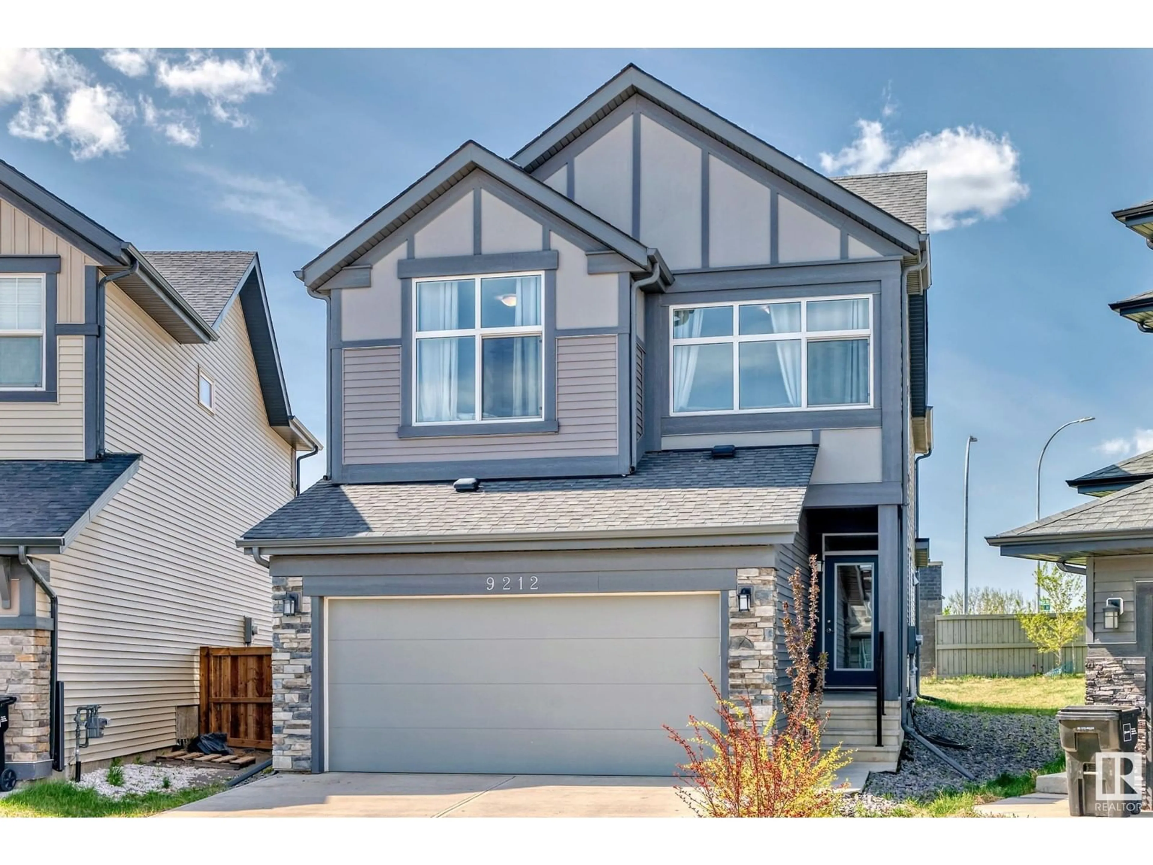 Home with vinyl exterior material, street for 9212 224 ST, Edmonton Alberta T5T7L9
