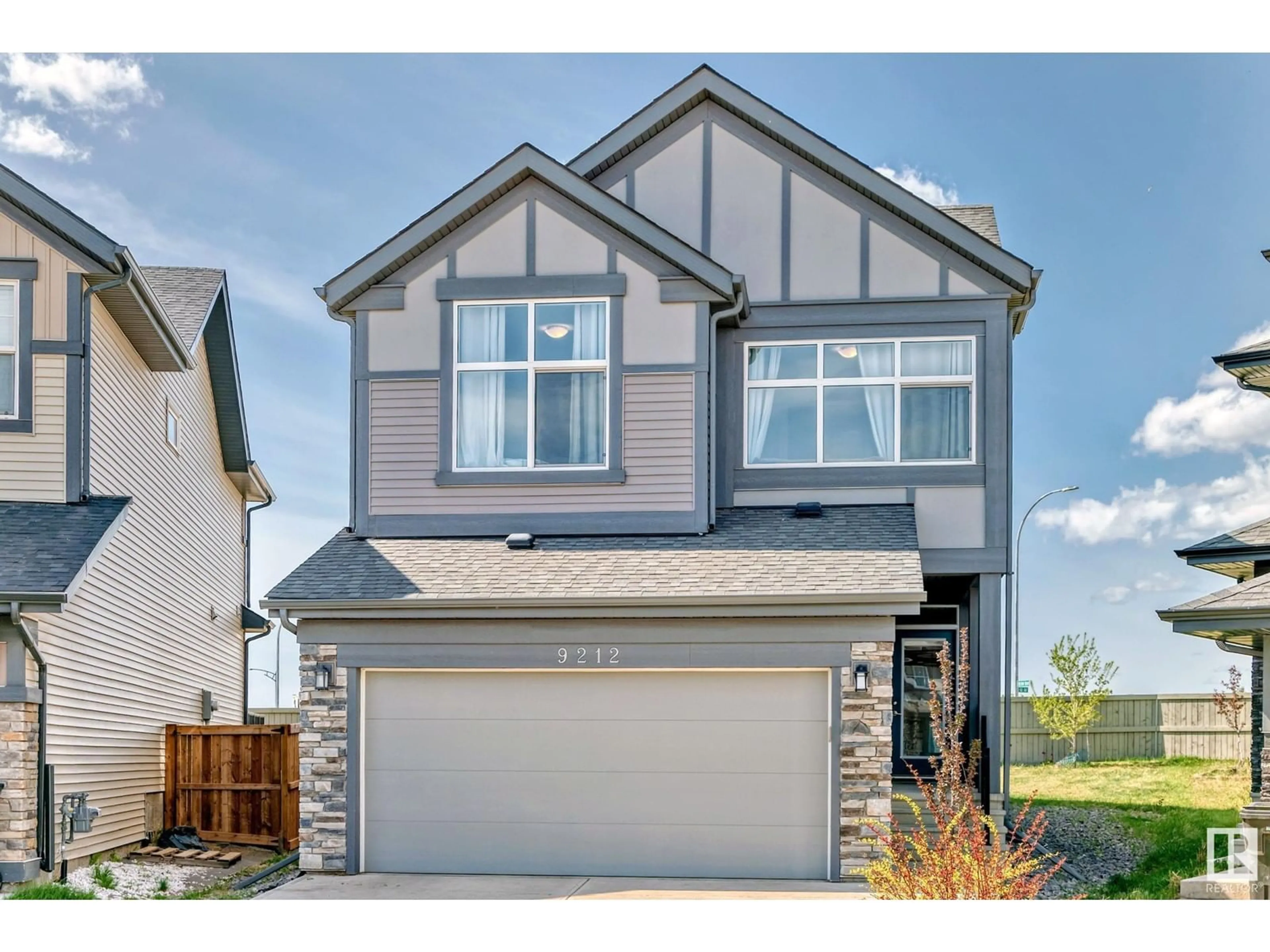 Home with vinyl exterior material, street for 9212 224 ST, Edmonton Alberta T5T7L9