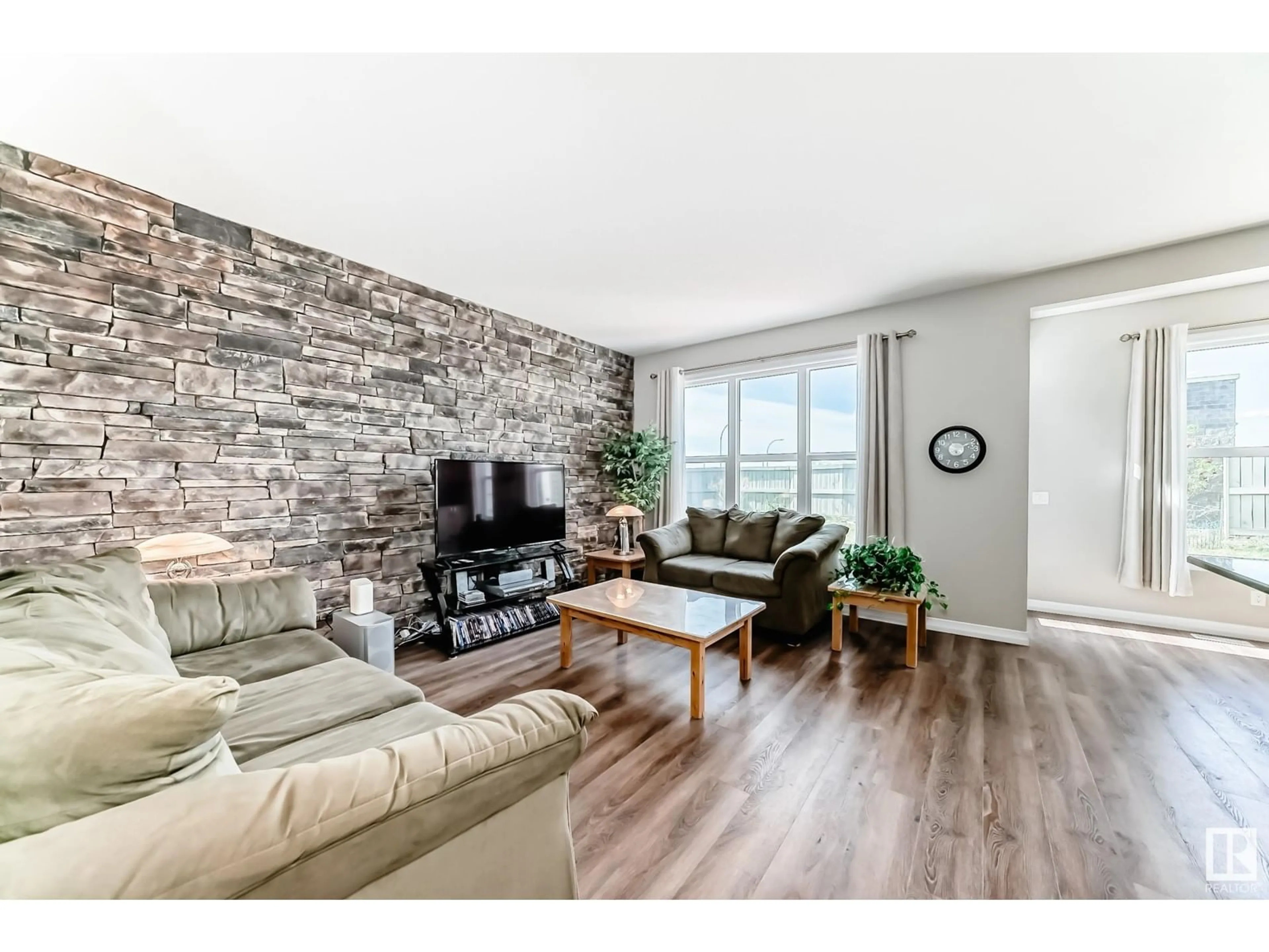 Living room with furniture, wood/laminate floor for 9212 224 ST, Edmonton Alberta T5T7L9